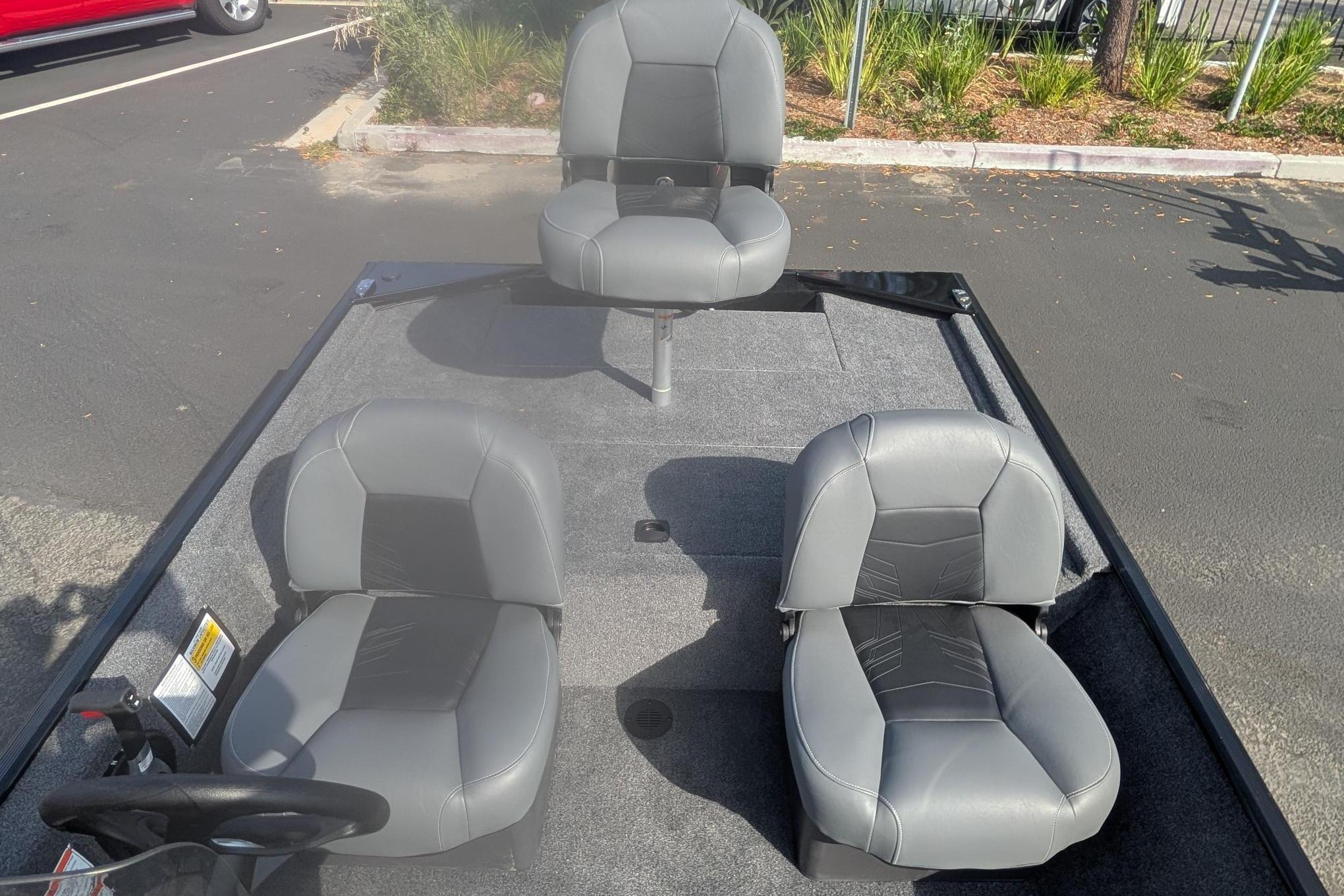 2026 Tracker Bass Tracker Classic XL boat interior with three gray seats.