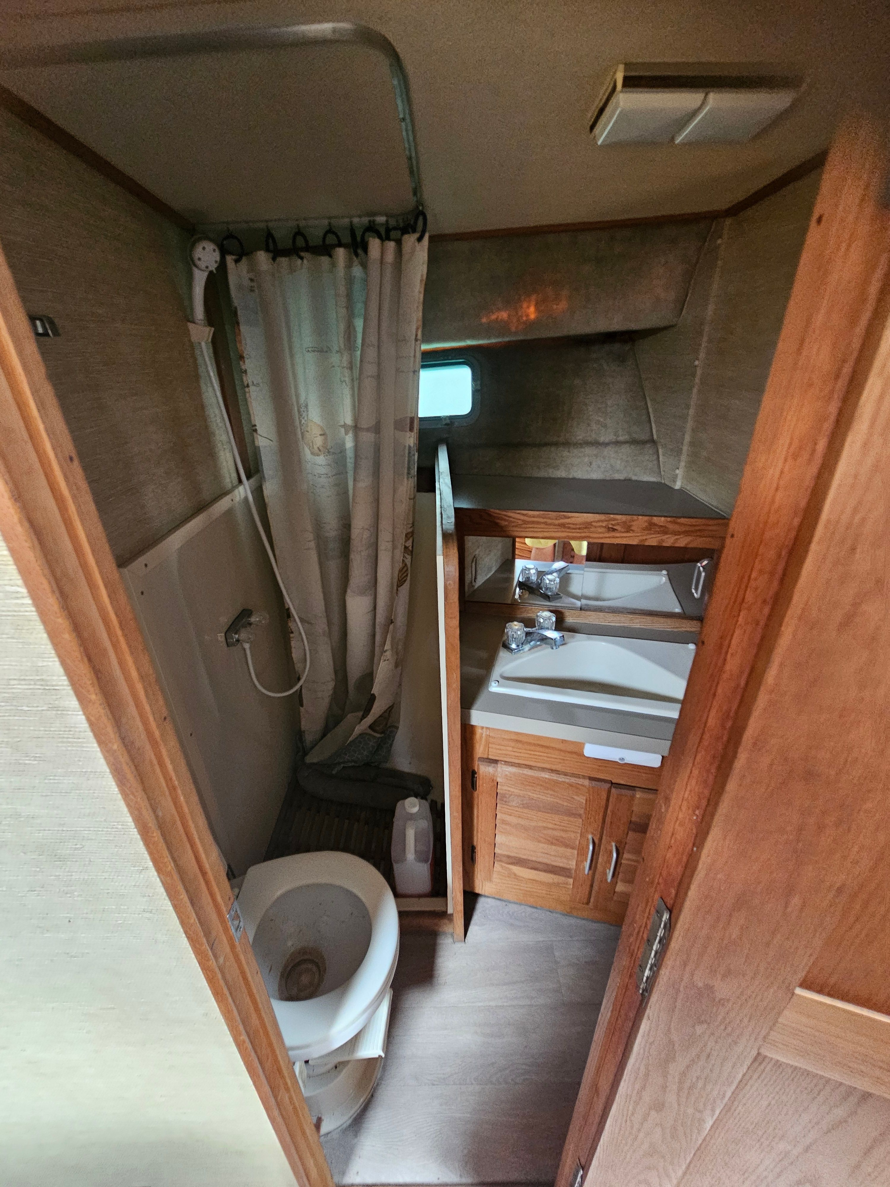 Bathroom in a 1984 Silverton 40 with shower, toilet, and sink.