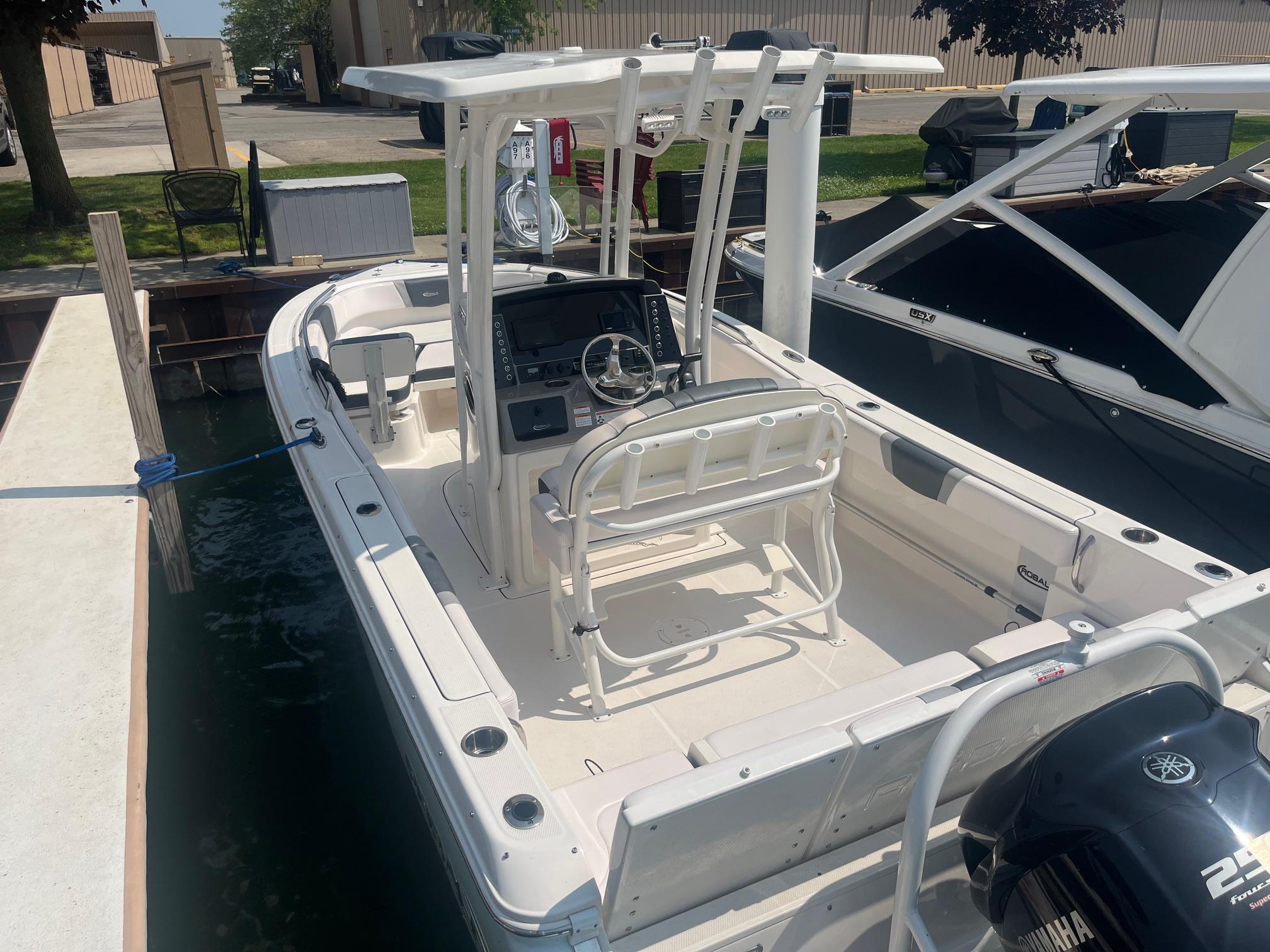 2020 Robalo R230 Center Console boat docked, featuring a Yamaha outboard motor.