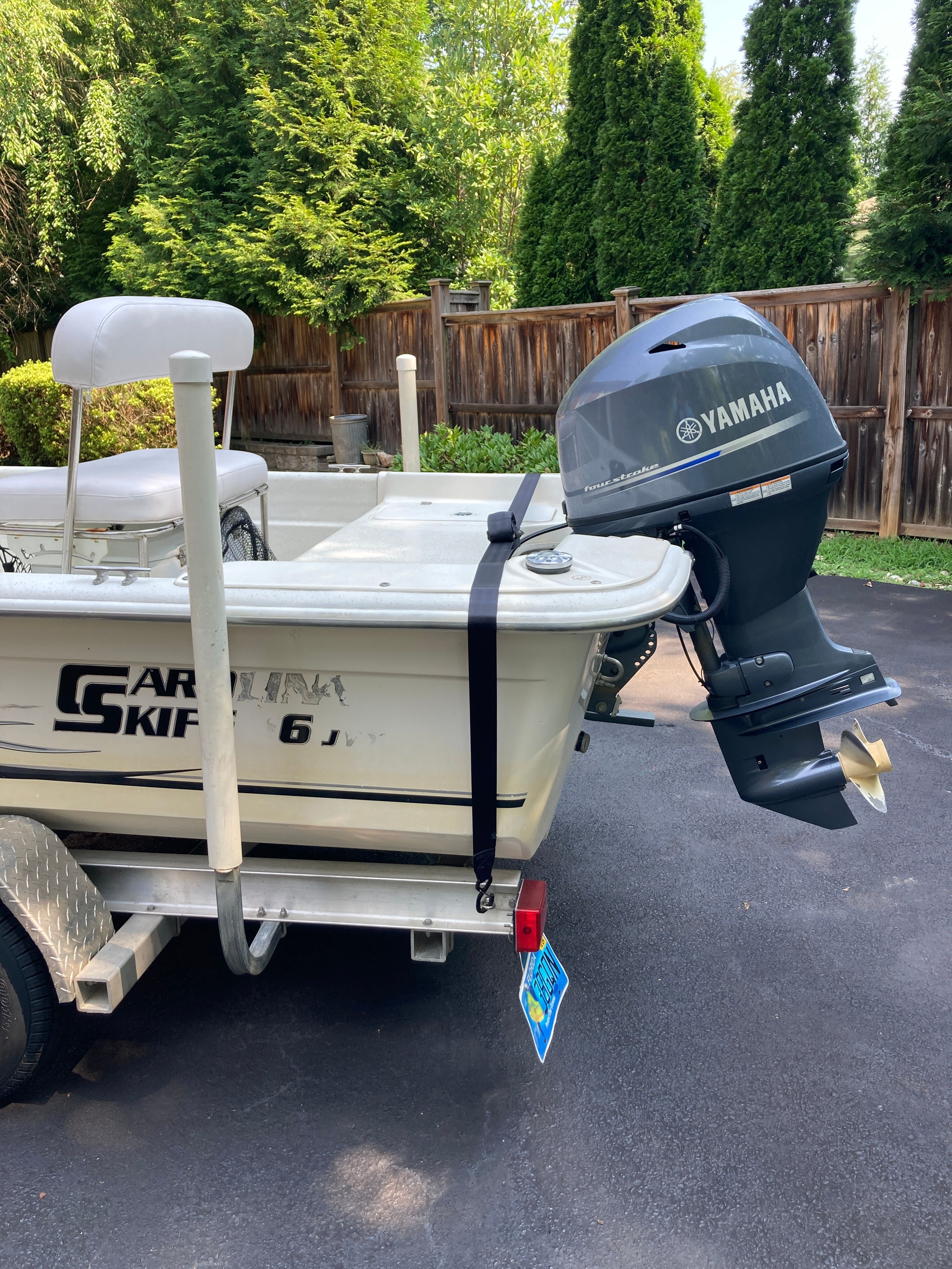 A 2012 Carolina Skiff JVX16CC boat on a trailer with a Yamaha outboard motor.