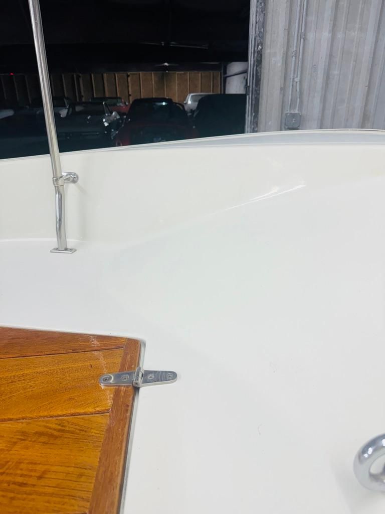 Close-up of a 1986 Boston Whaler 17 Montauk featuring wood and metal accents.