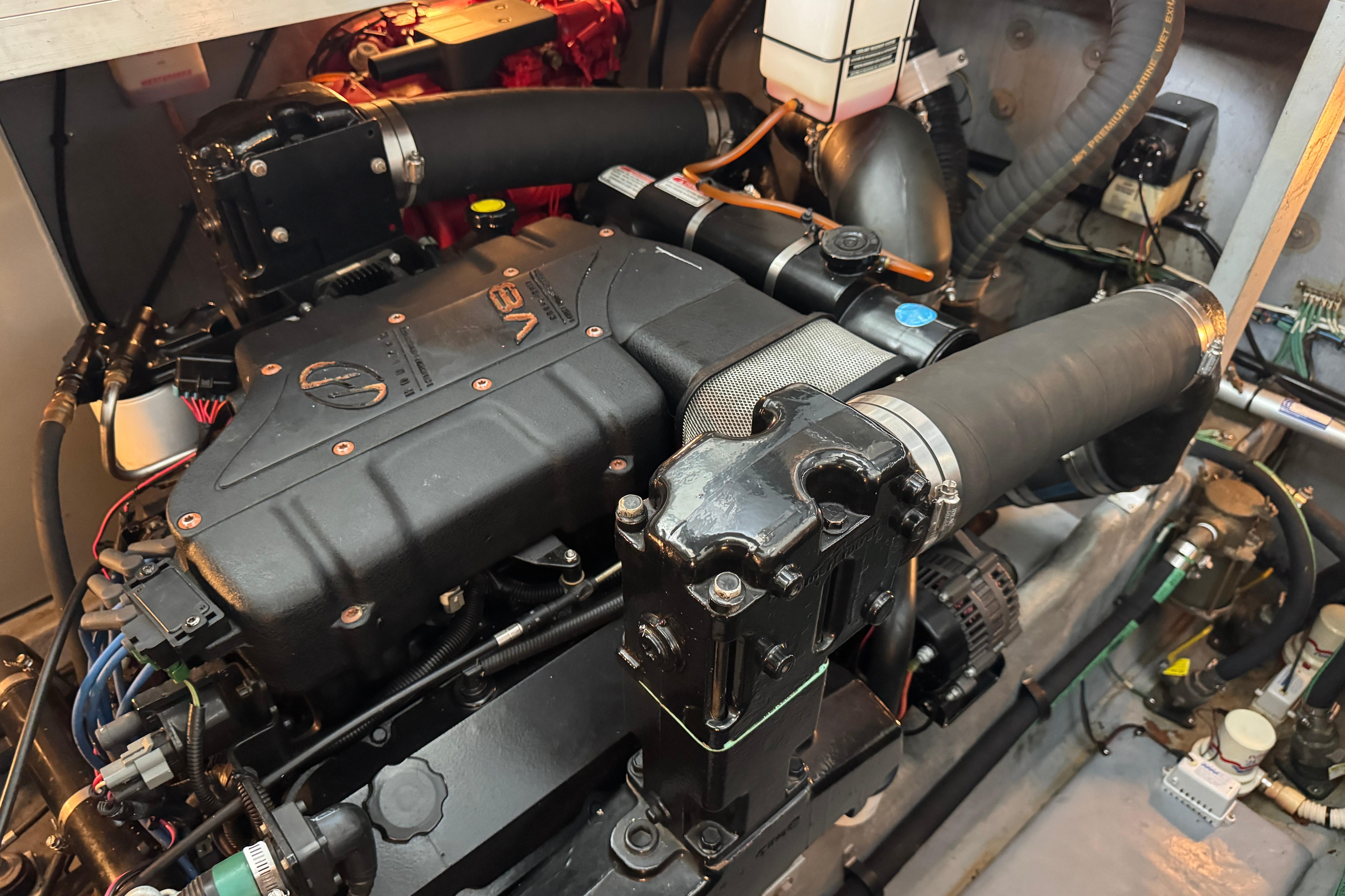 Engine compartment of a 2001 Sea Ray 380 Sundancer boat, showcasing detailed components.