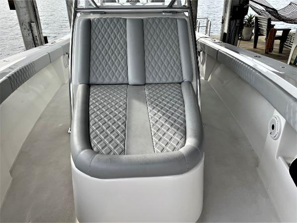 2020 Front Runner 39 Center Console boat with diamond-stitched seating, docked by the water.