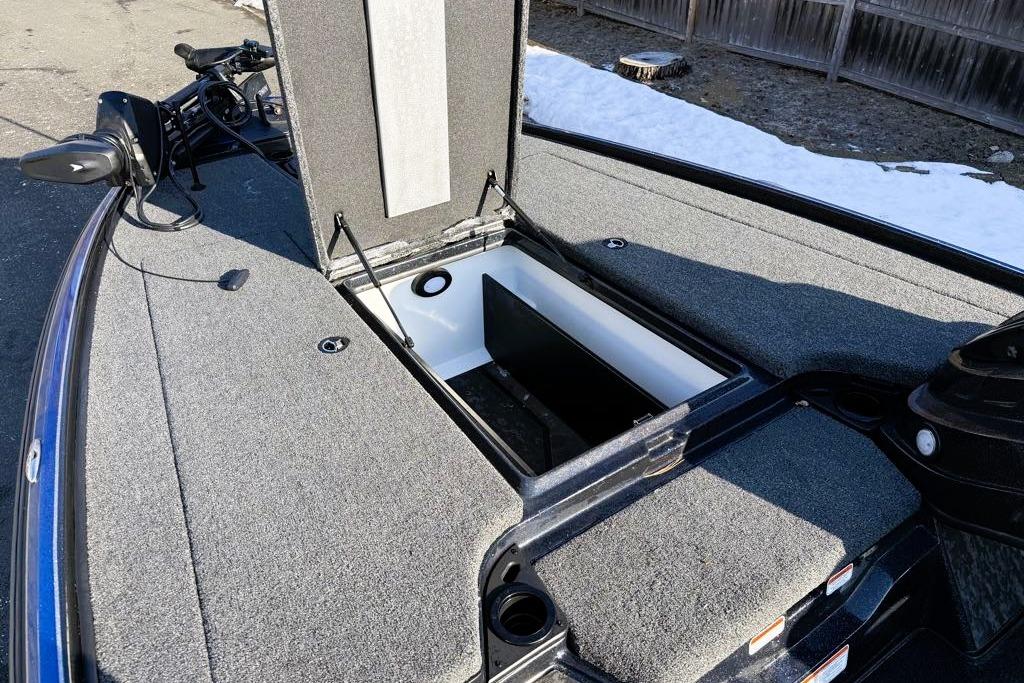 2026 Nitro Z20 XL Pro boat with open storage compartment, gray carpet, and trolling motor.