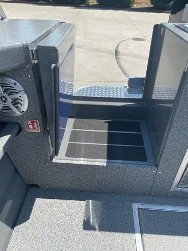 2025 Spartan 240 Maximus Pro boat interior with non-slip flooring and speaker system.