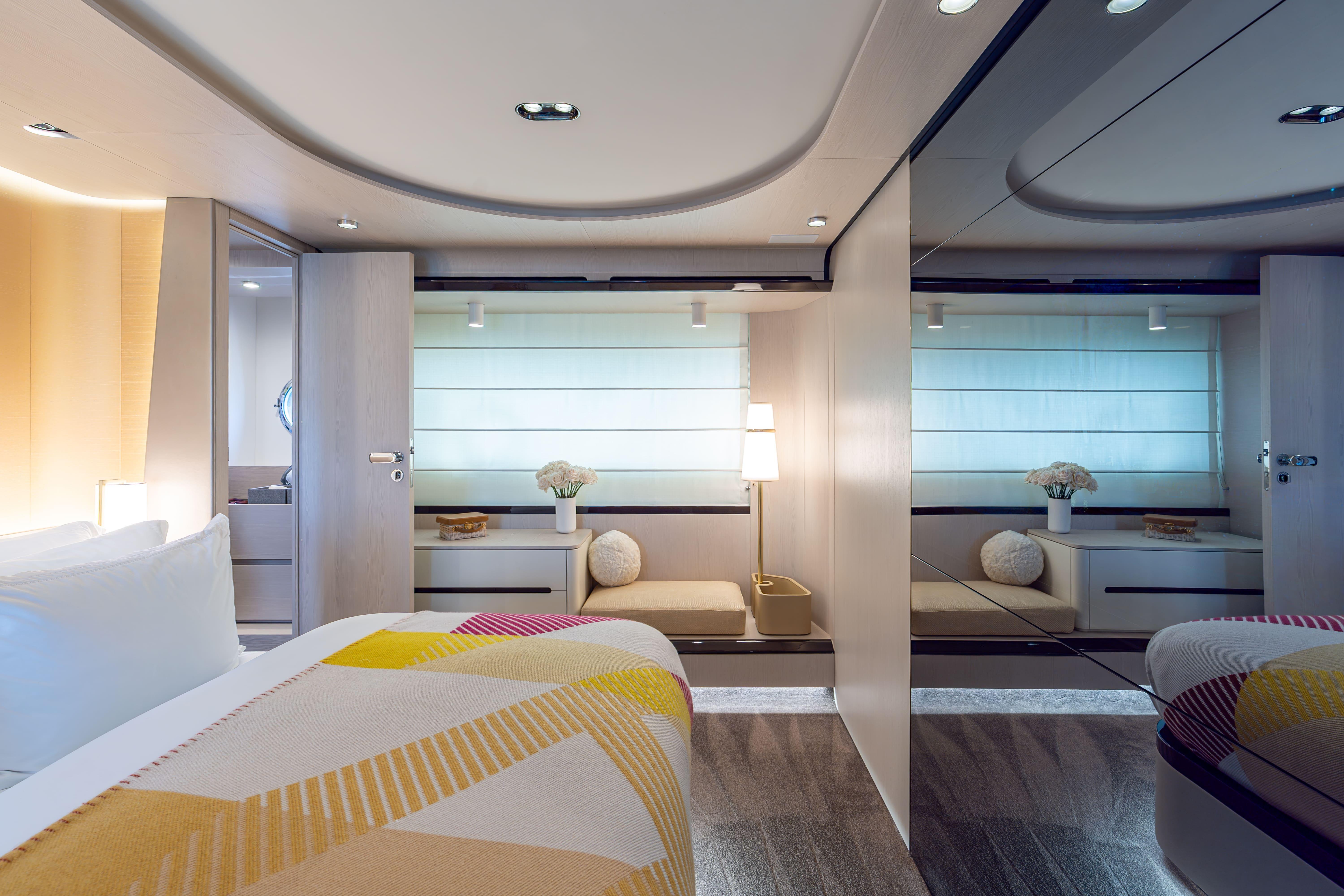 Luxurious interior of 2022 Azimut 78 yacht, featuring modern bedroom design and elegant decor.