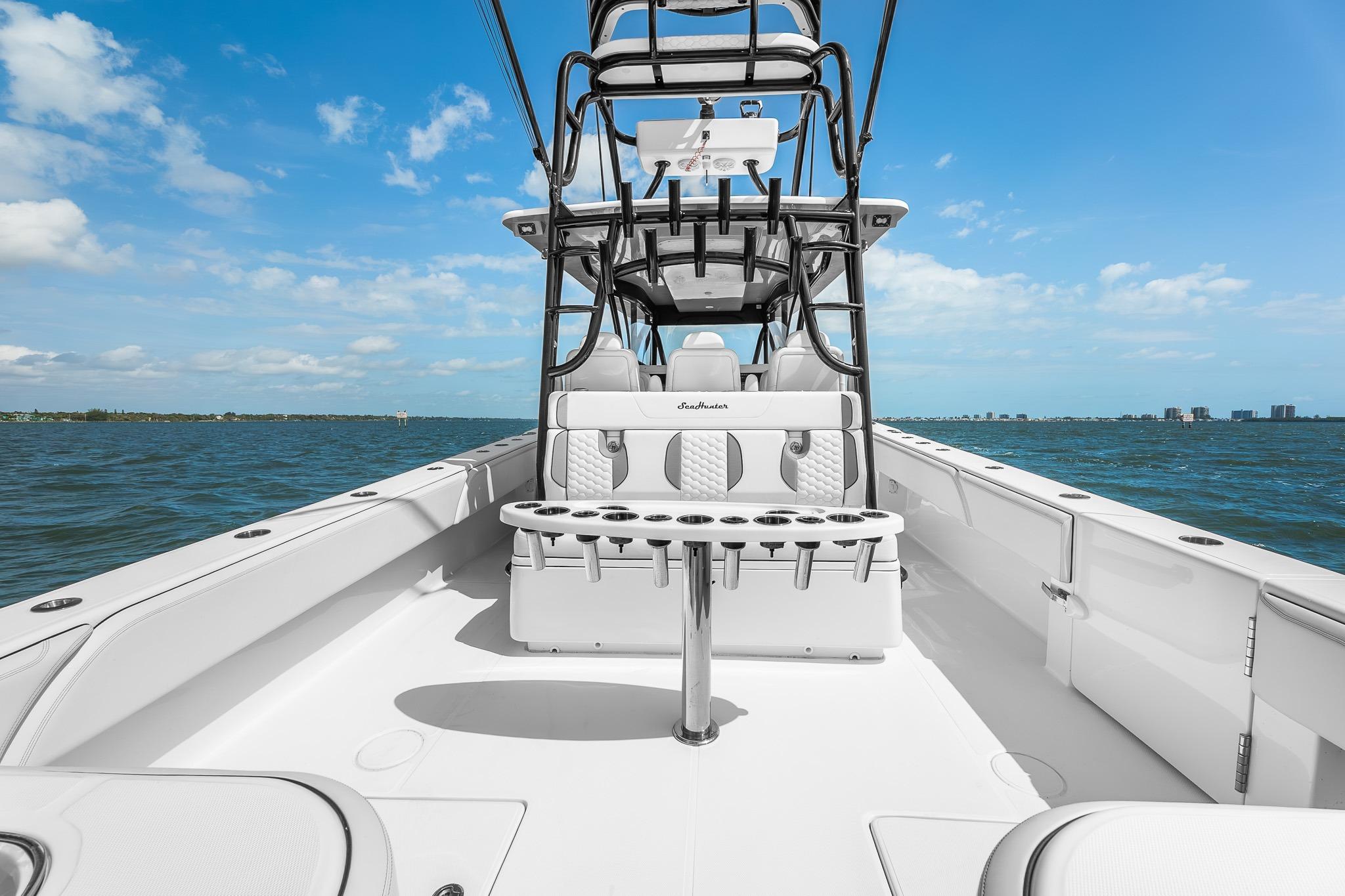 2025 SeaHunter 46 CTS boat on open water under clear blue sky.