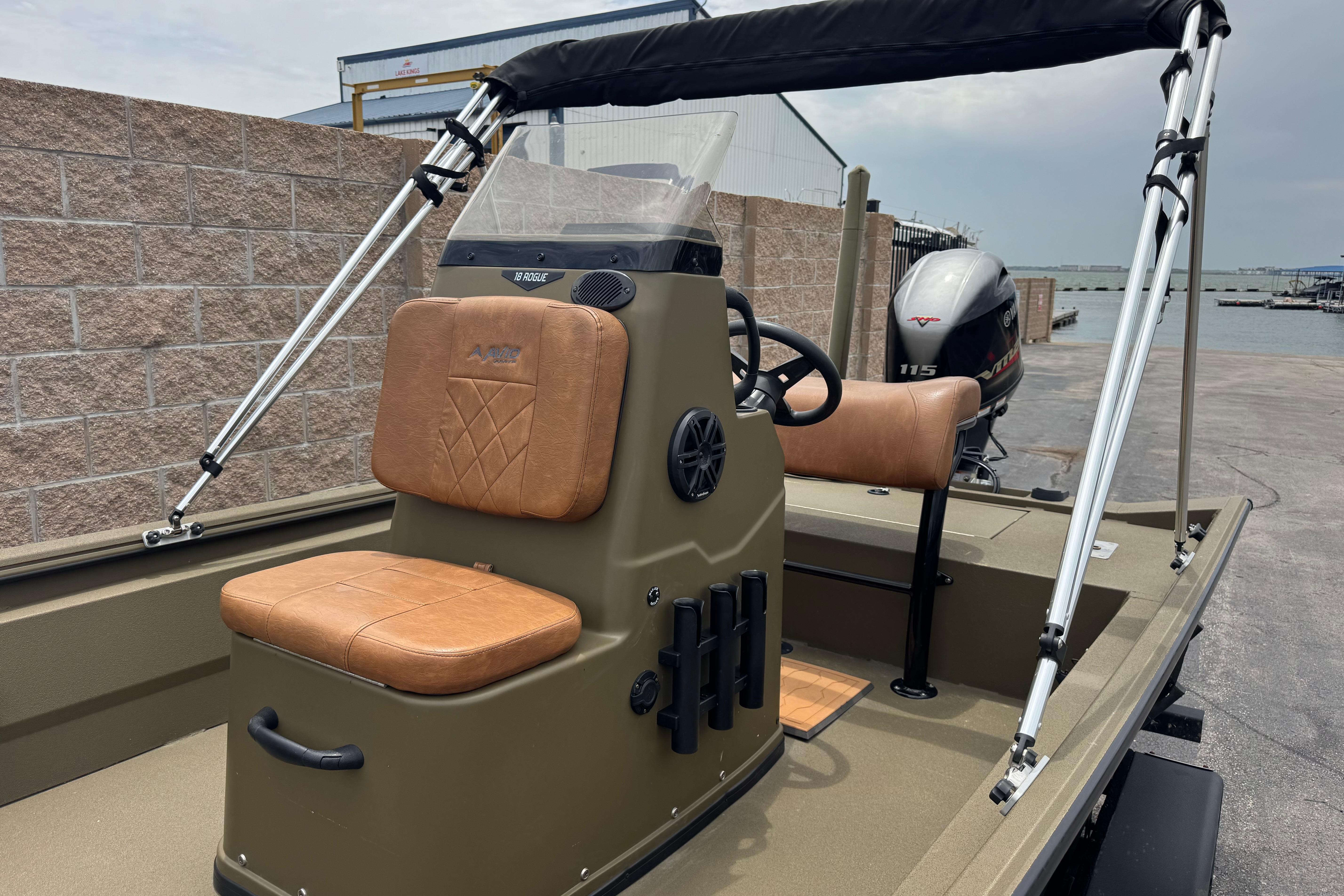 2023 Avid 18 Rogue CC boat with tan seating and Yamaha outboard motor.