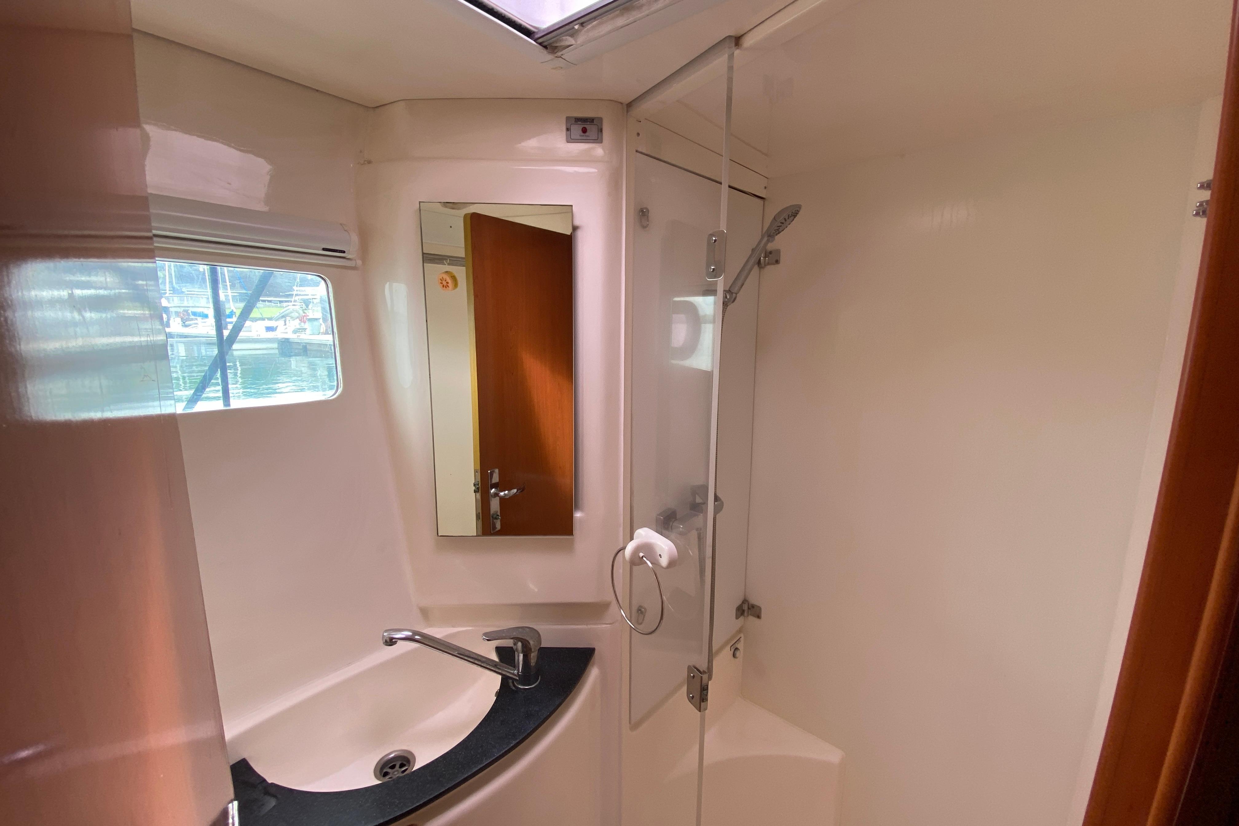 Bathroom interior of 2010 Leopard 46 yacht with shower and sink.