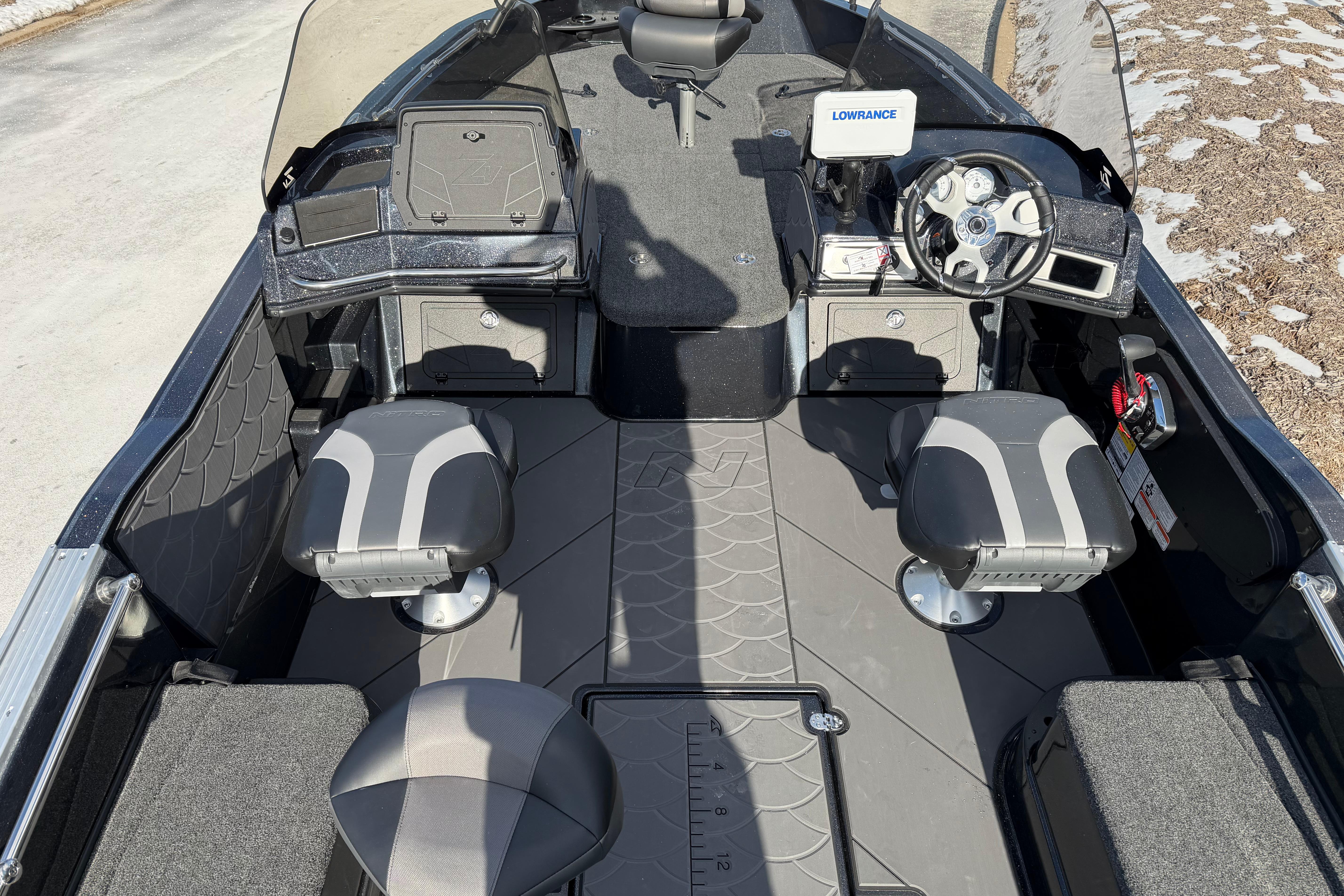 2026 Nitro ZV20 boat interior with dual seats, steering wheel, and Lowrance navigation system.