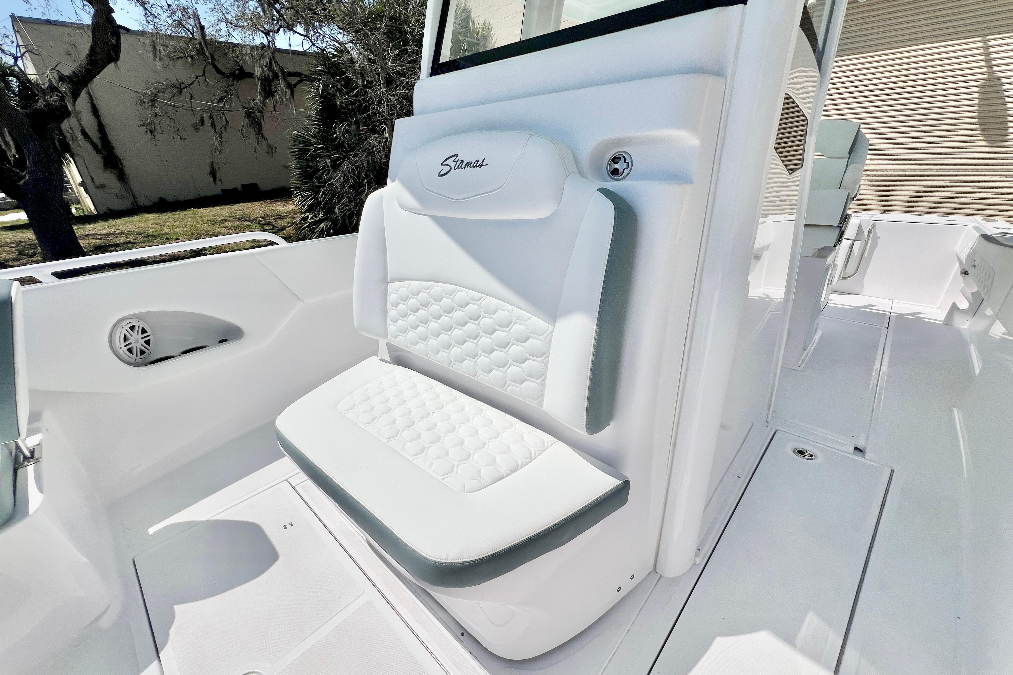 2026 Stamas 31T Aventura boat interior with white cushioned seating and sleek design.