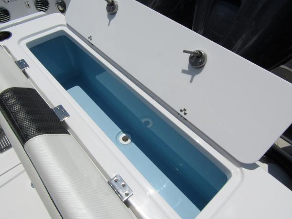 2024 Wellcraft 352 Fisherman boat livewell compartment with open lid.