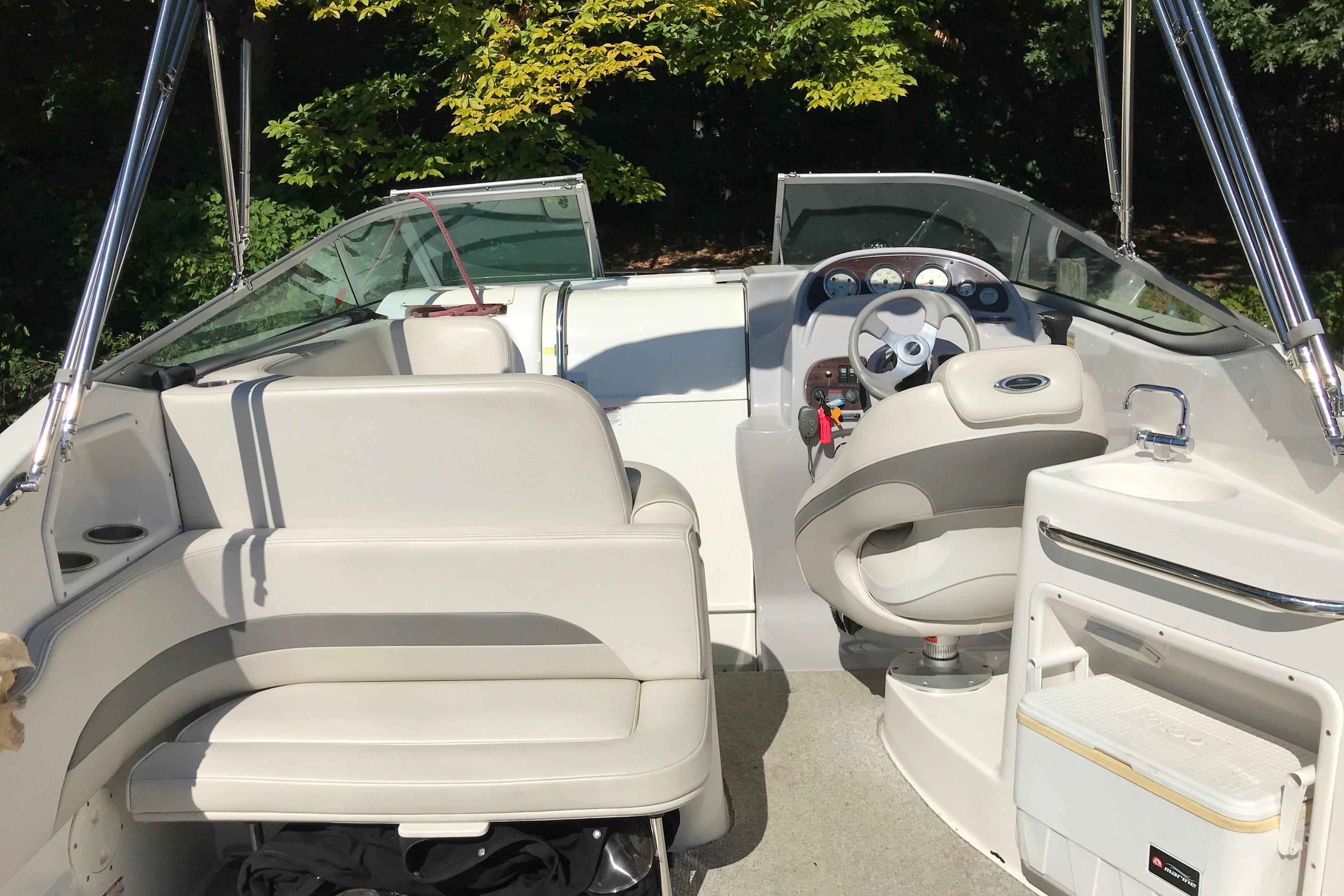 2005 Chaparral Signature 260 boat interior with seating and steering wheel.