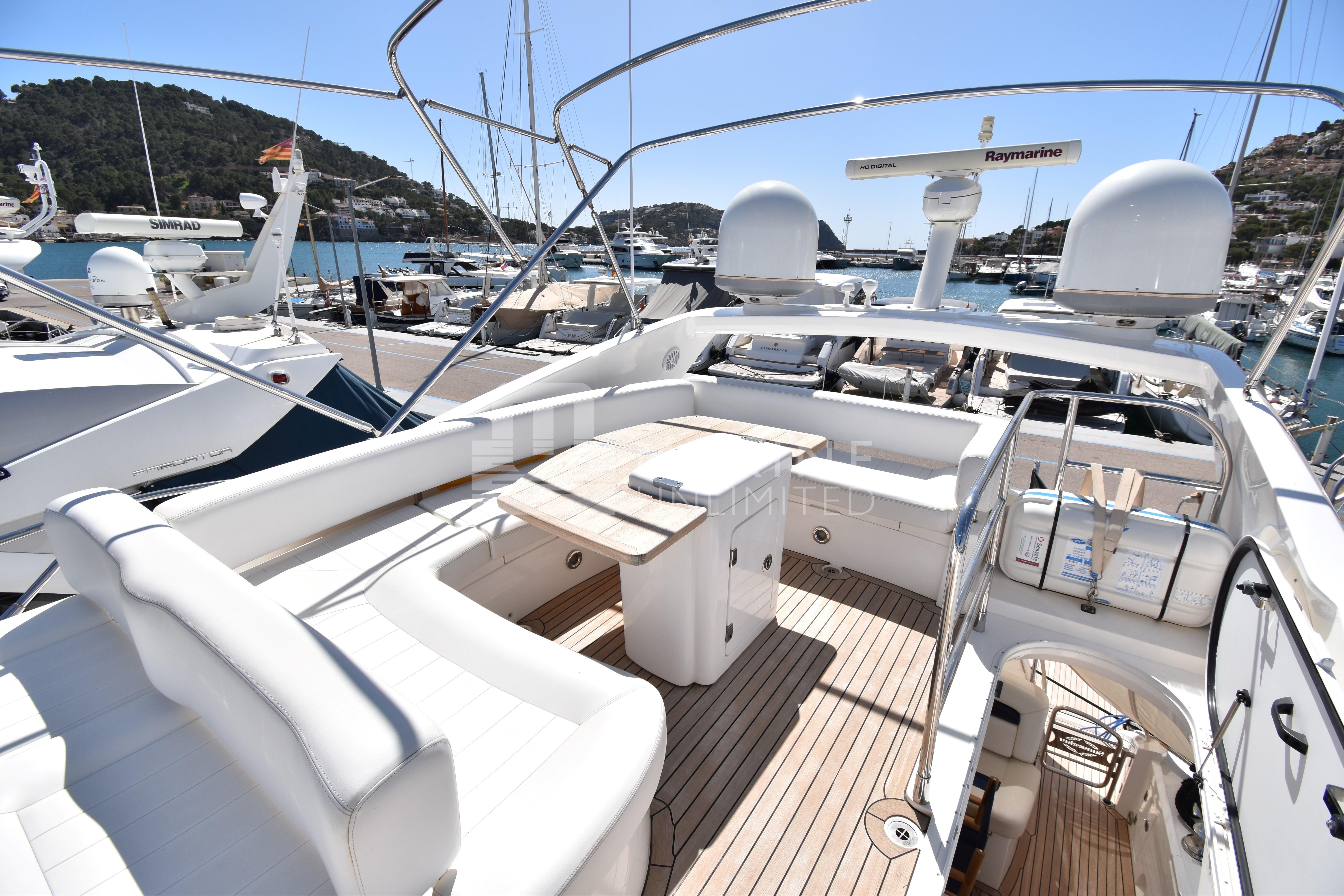 Luxurious 2010 Sunseeker Manhattan 52 yacht with spacious deck and elegant seating.