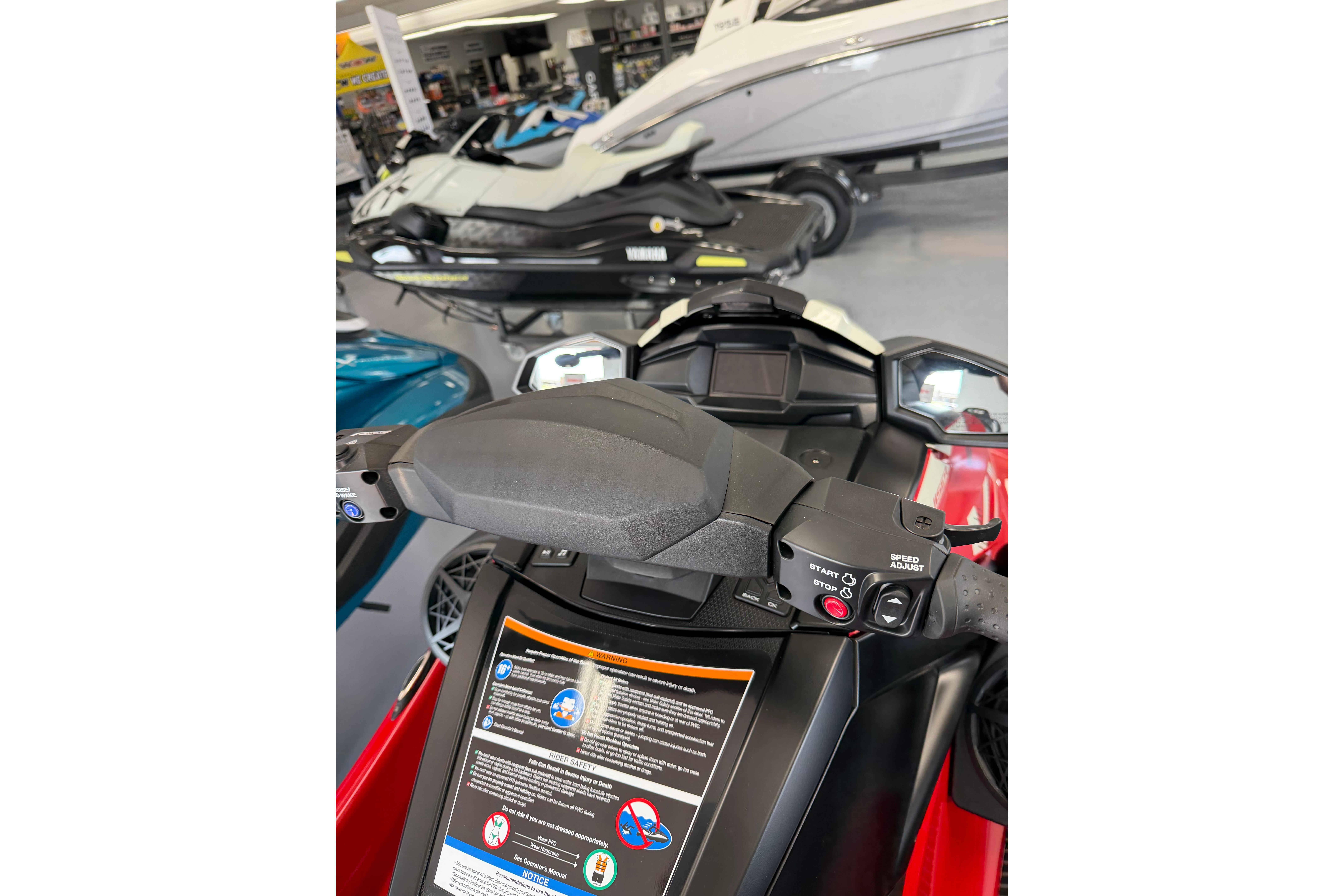 2026 Yamaha WaveRunner VX Cruiser dashboard in showroom, featuring control panel and handlebars.