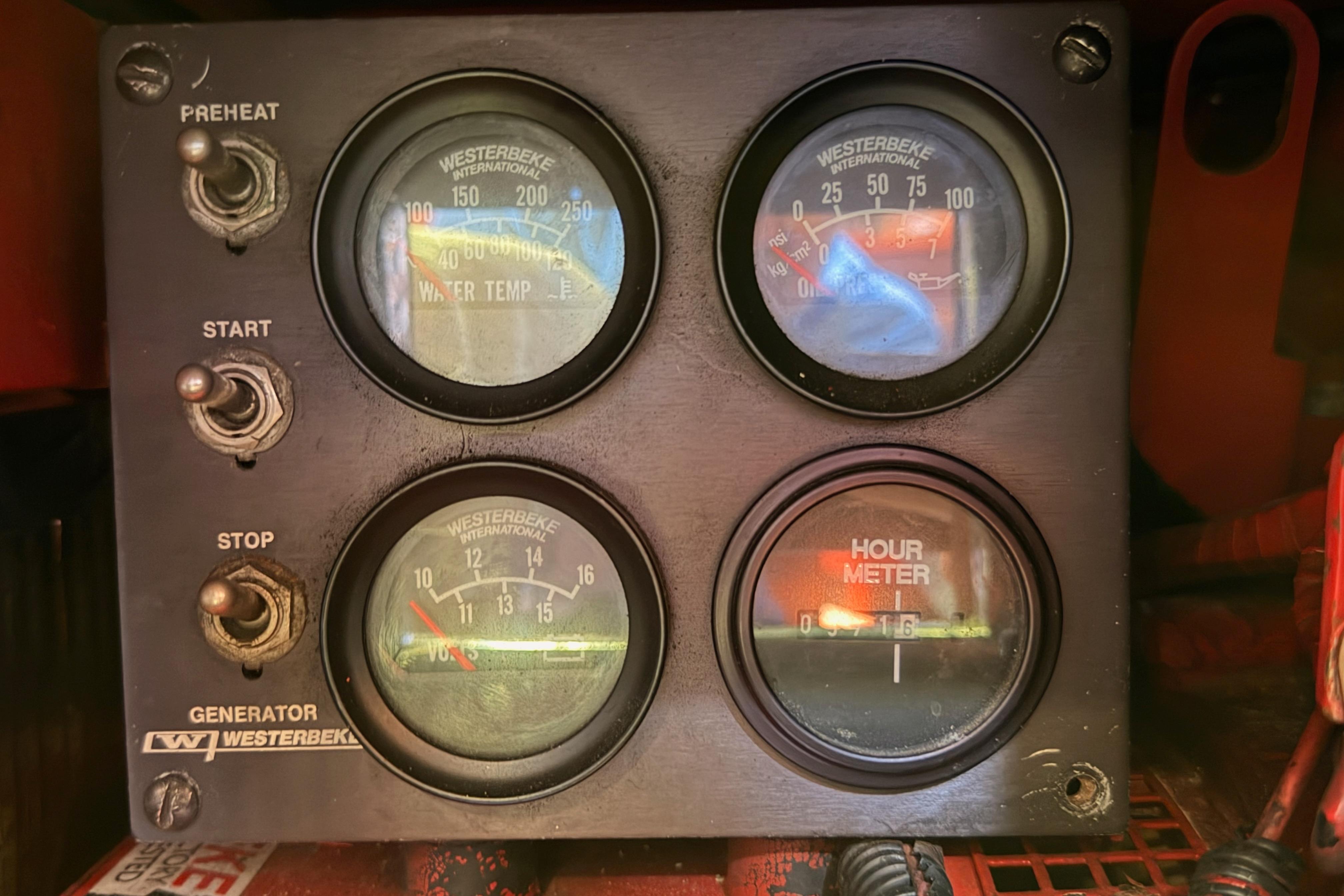 Control panel of a 1991 Hylas 51 with Westerbeke generator gauges and switches.