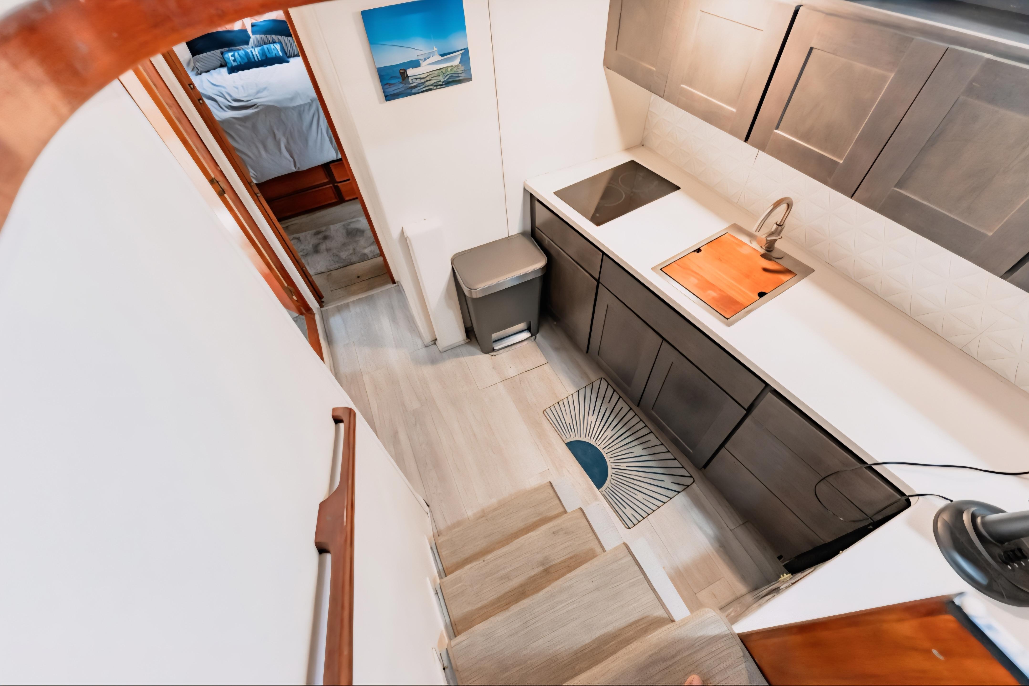 1988 Ocean Yachts 48 Super Sport interior with modern kitchen and cozy bedroom.