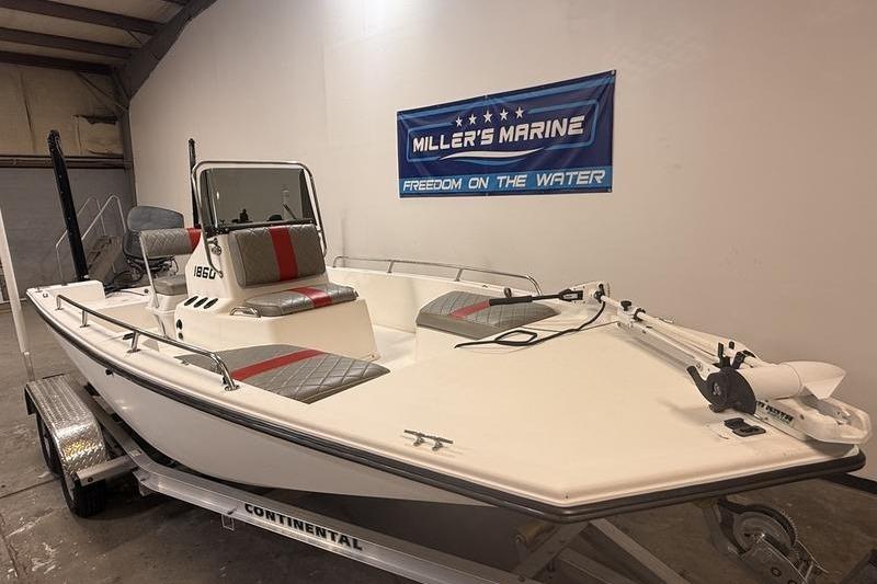 1996 Century 1800 Center Console boat on trailer at Miller's Marine showroom.