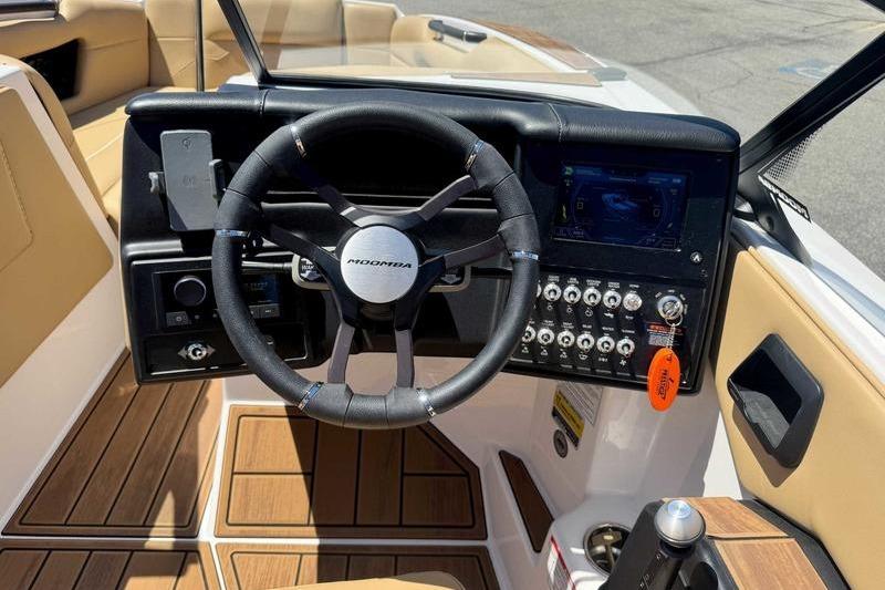 2023 Moomba Mojo Pro boat dashboard with steering wheel and control panel.