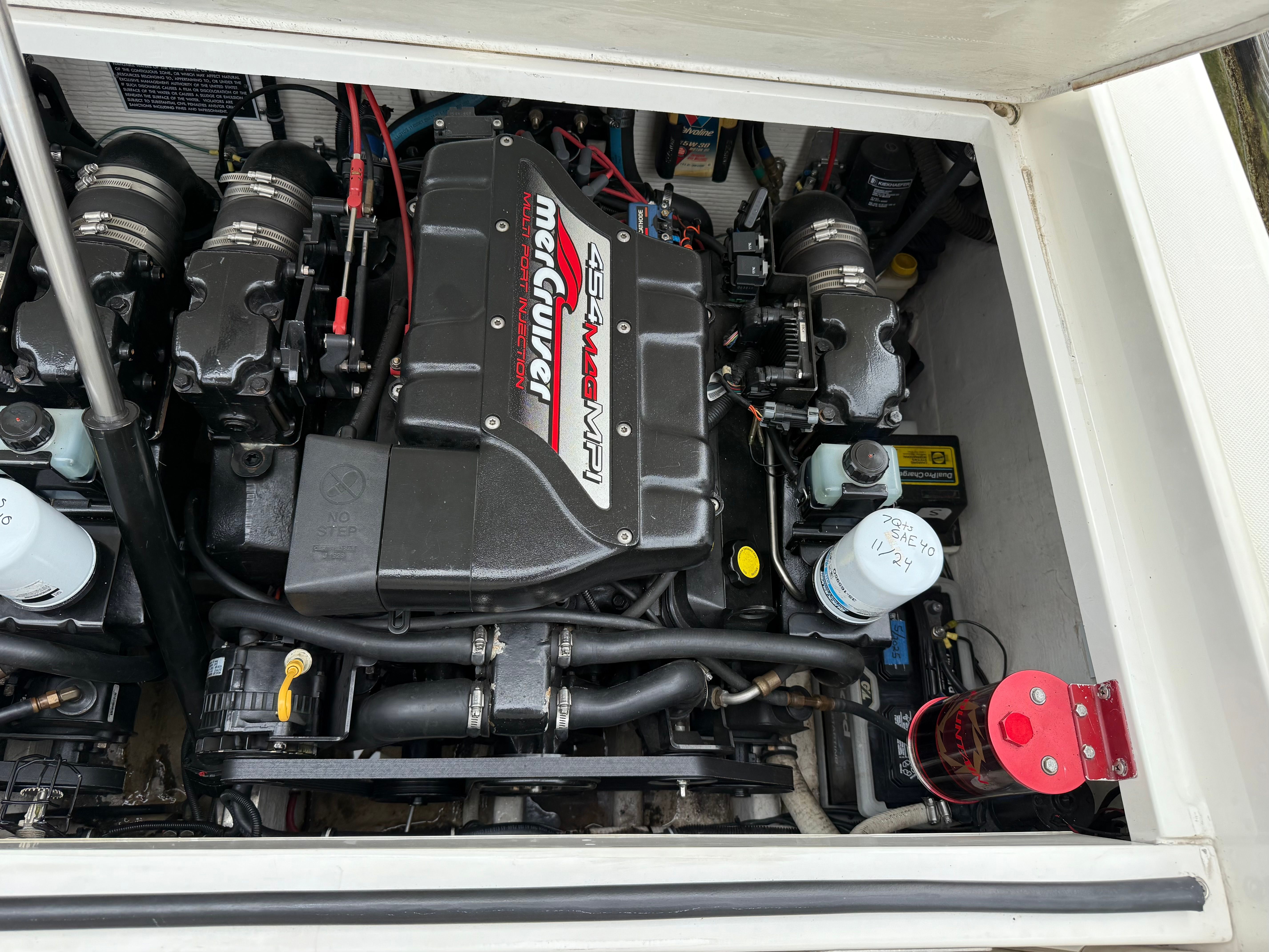 Engine compartment of a 1999 Fountain 32 Sport Fish Cruiser with MerCruiser 454 MAG MPI engine.