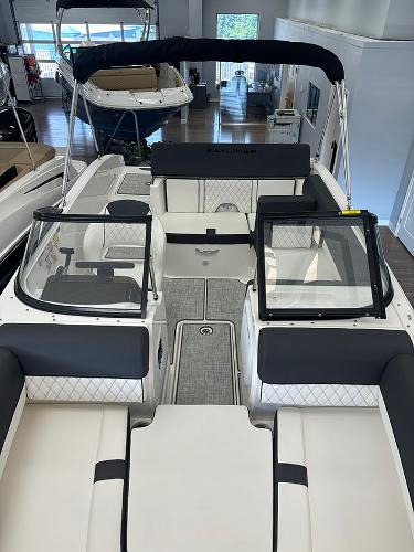 2024 Bayliner DX 2050 boat interior with seating and windshield.
