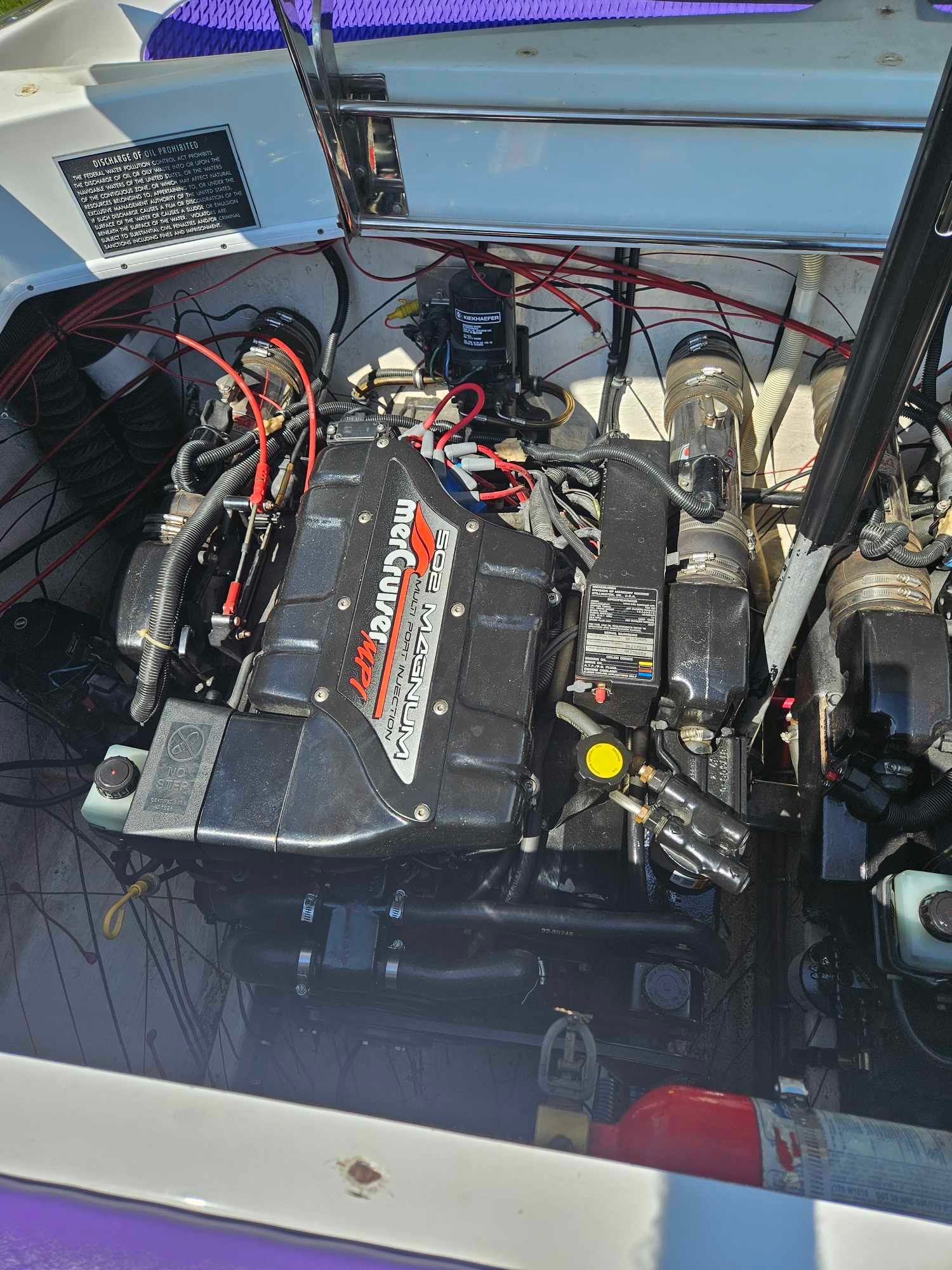 Engine compartment of a 1997 Baja 38 Special Boss with MerCruiser 502 Magnum.