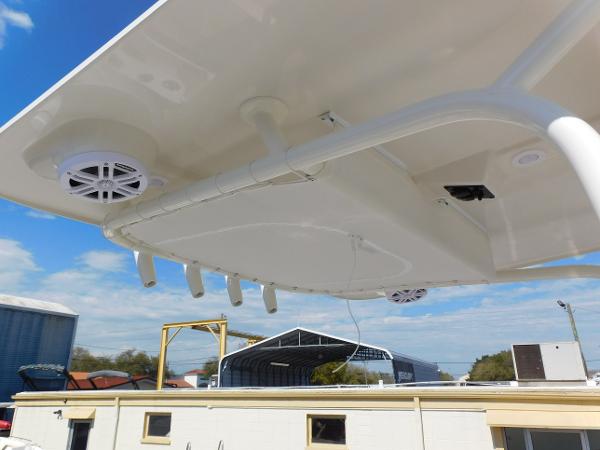 2024 Sailfish 242 CC boat hardtop with speakers and rod holders.