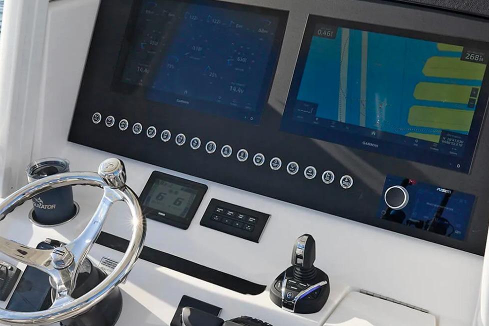 2027 Regulator 31 boat dashboard with dual Garmin displays and steering wheel.