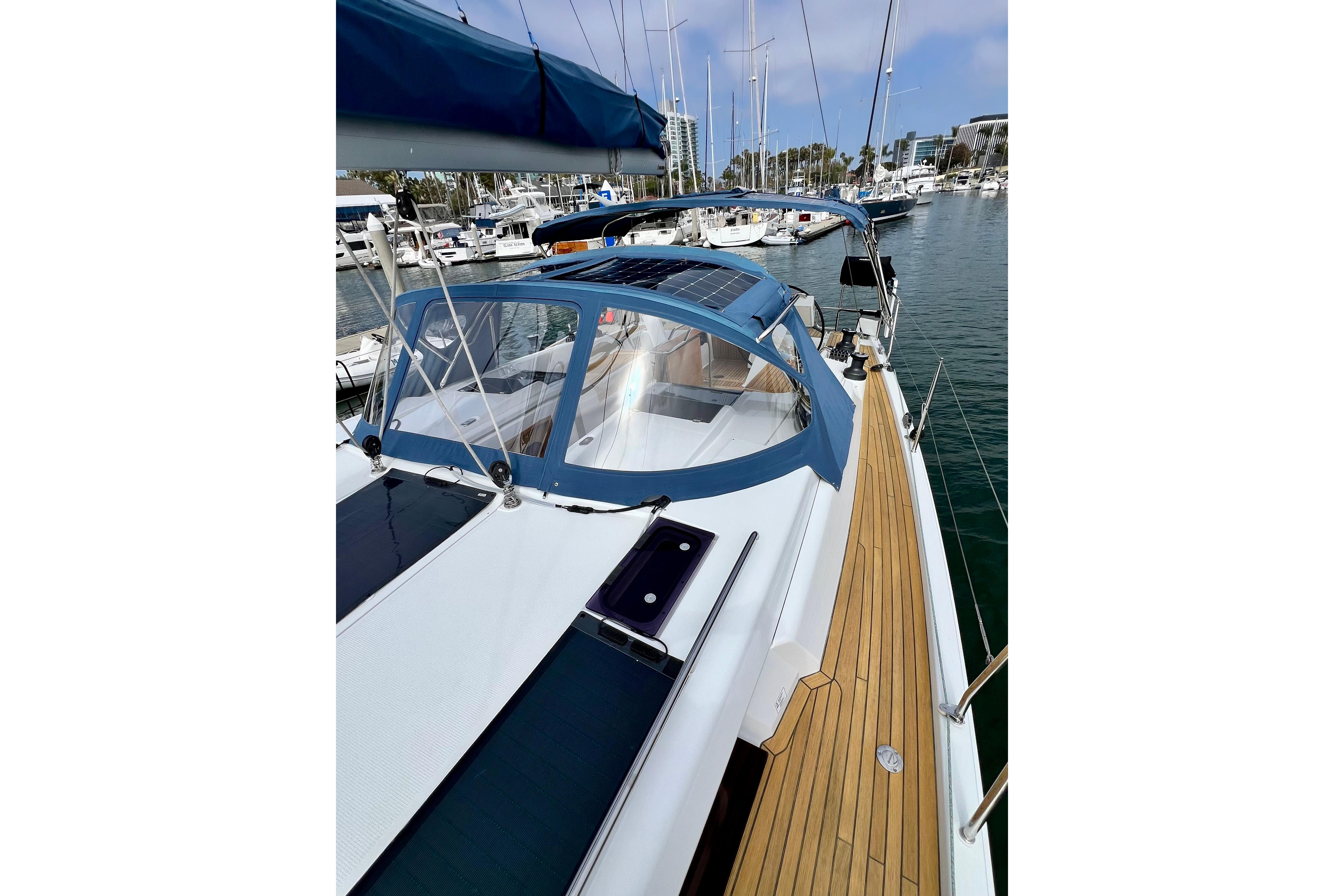 2016 Hanse 455 sailboat docked in marina, featuring sleek design and spacious deck.