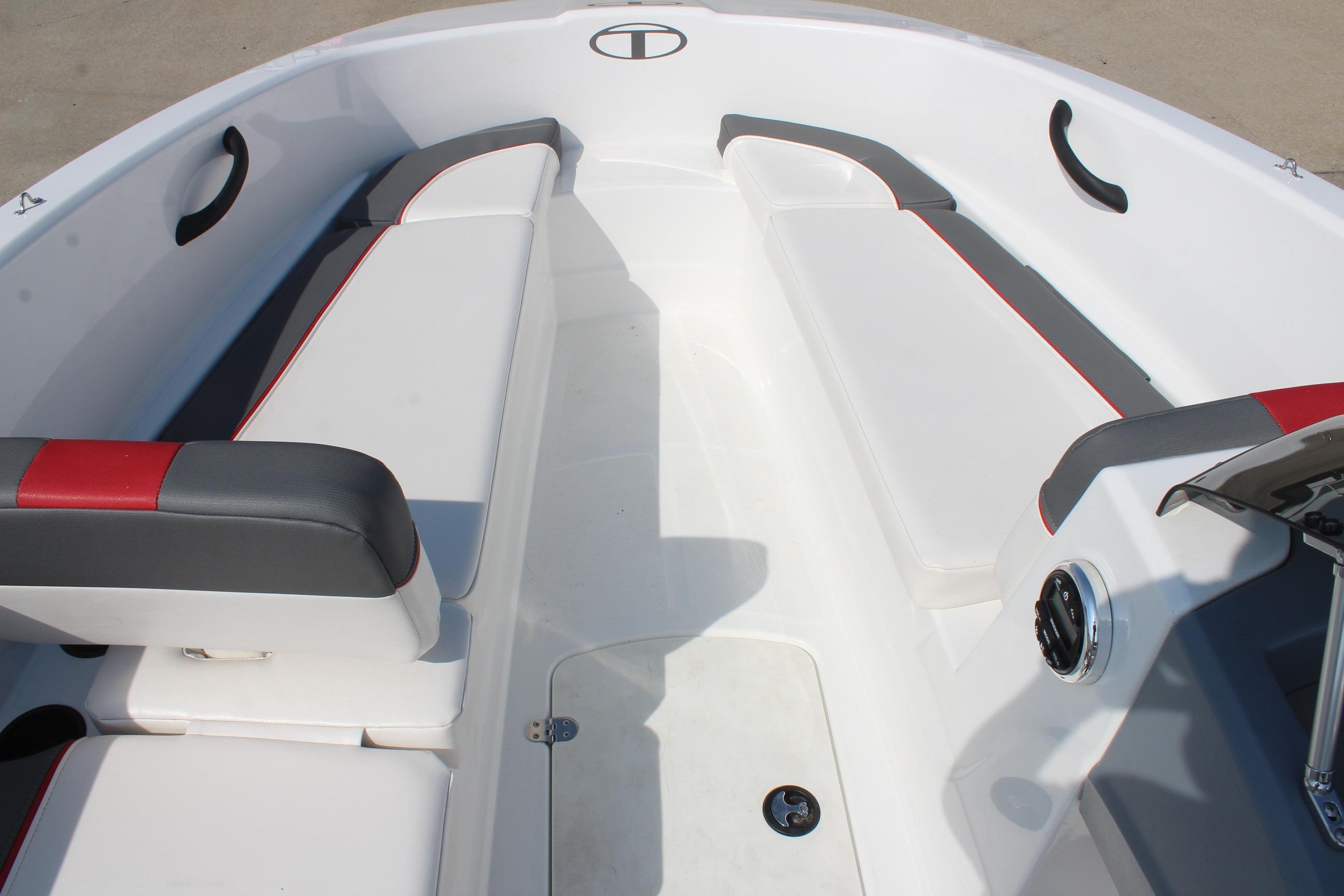 2023 Tahoe T16 boat interior with white and gray seating, red accents, and modern design.