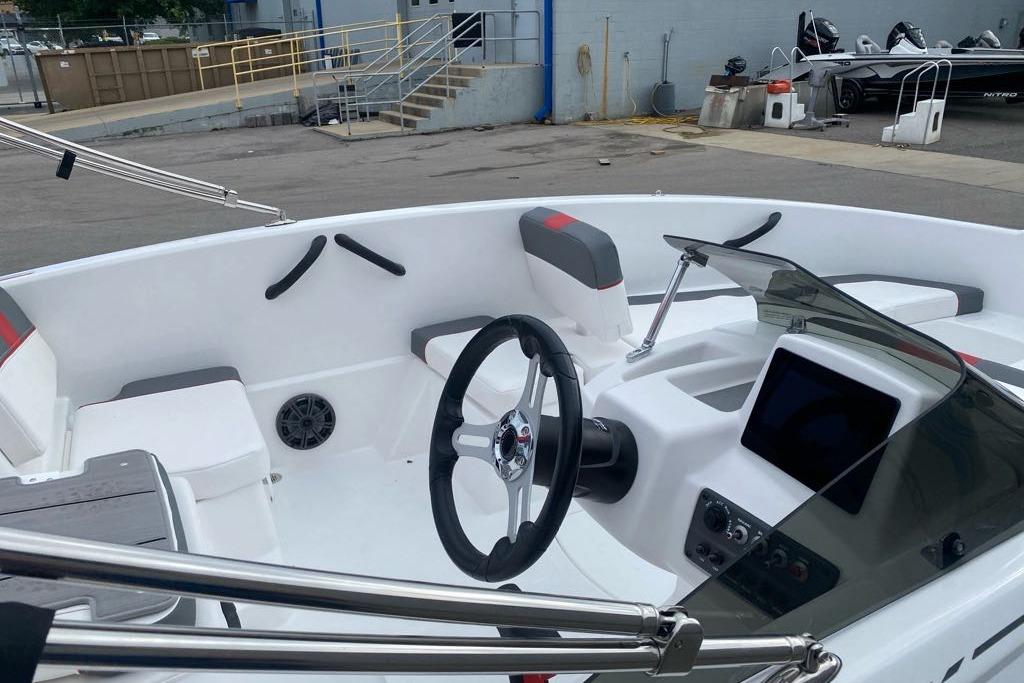 2026 Tahoe T16 boat interior with steering wheel, seating, and control panel.