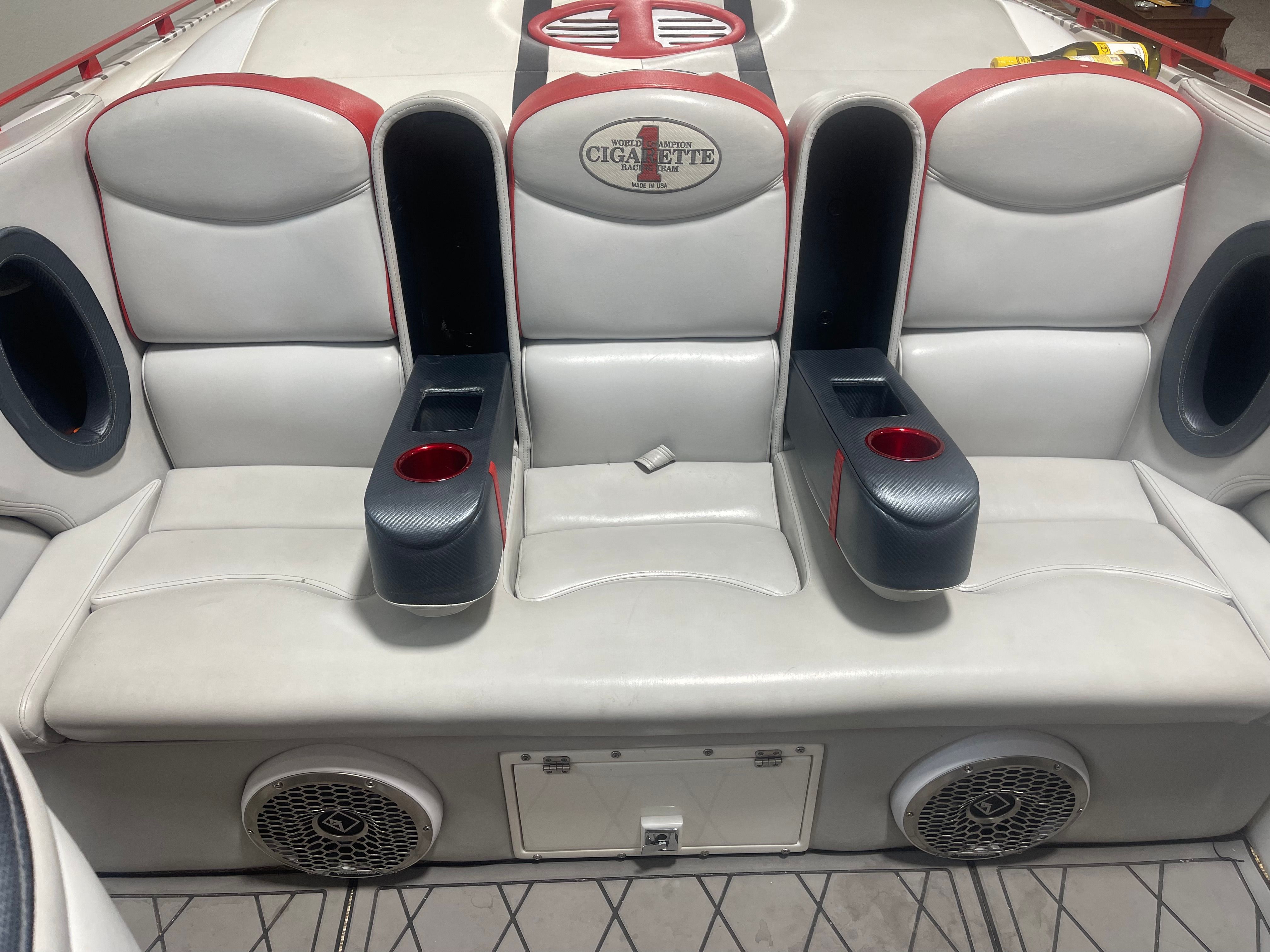 Interior of a 2004 Cigarette 38' Top Gun boat with white seating.