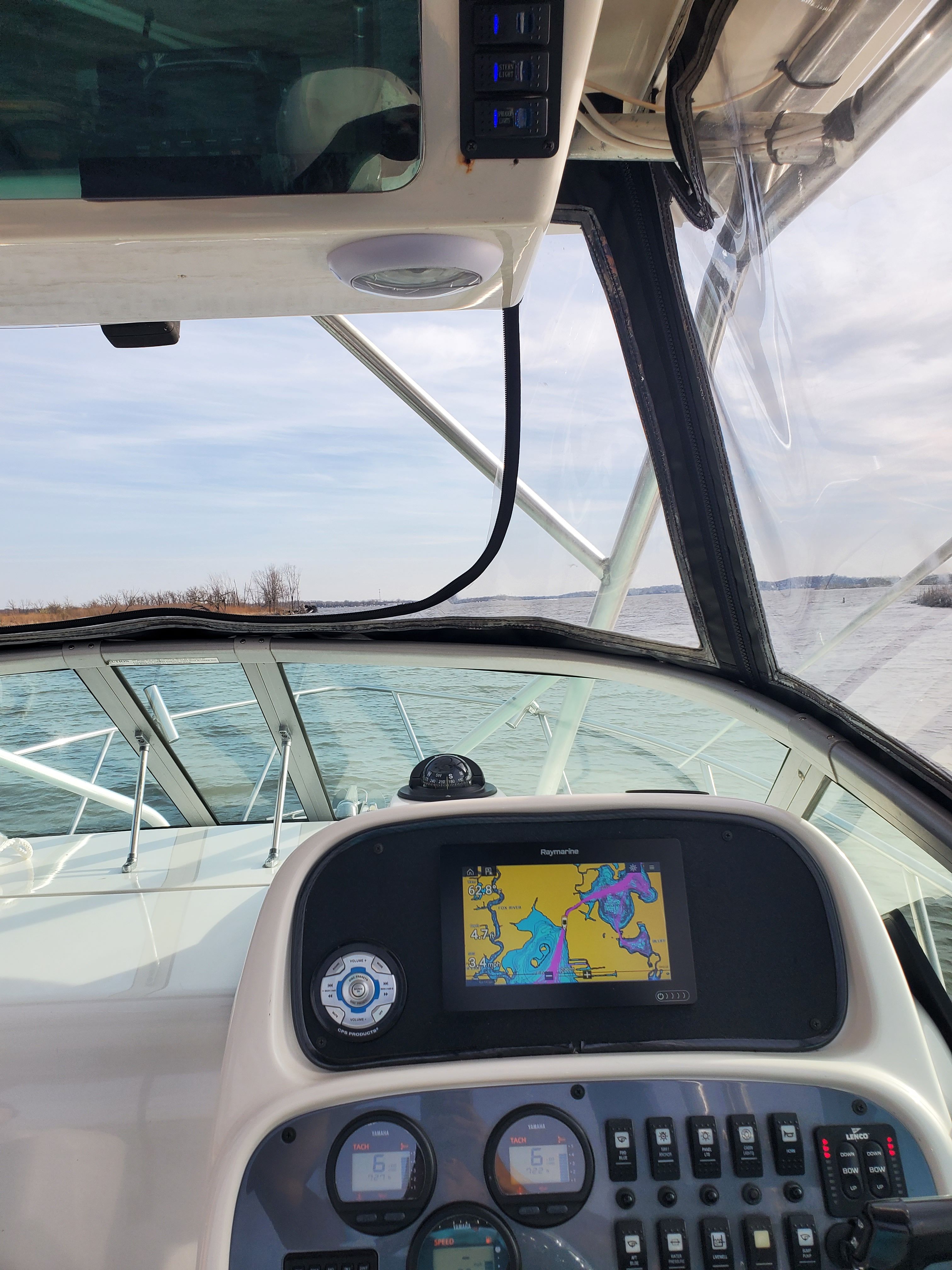 Interior view of a 2005 Robalo R265 Walkaround boat with navigation system.