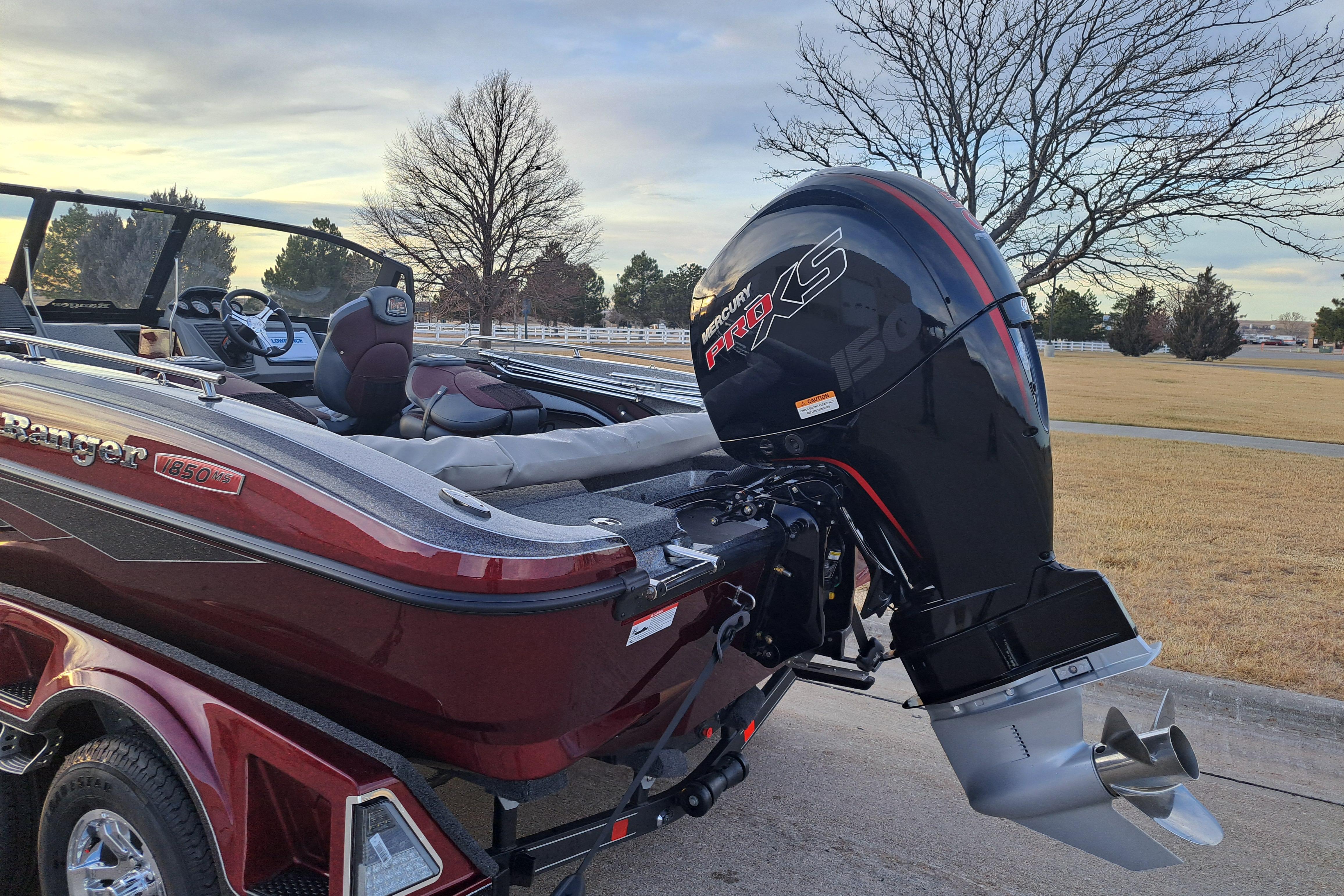 2026 Ranger 1850MS boat with Mercury Pro XS engine, parked on a driveway.