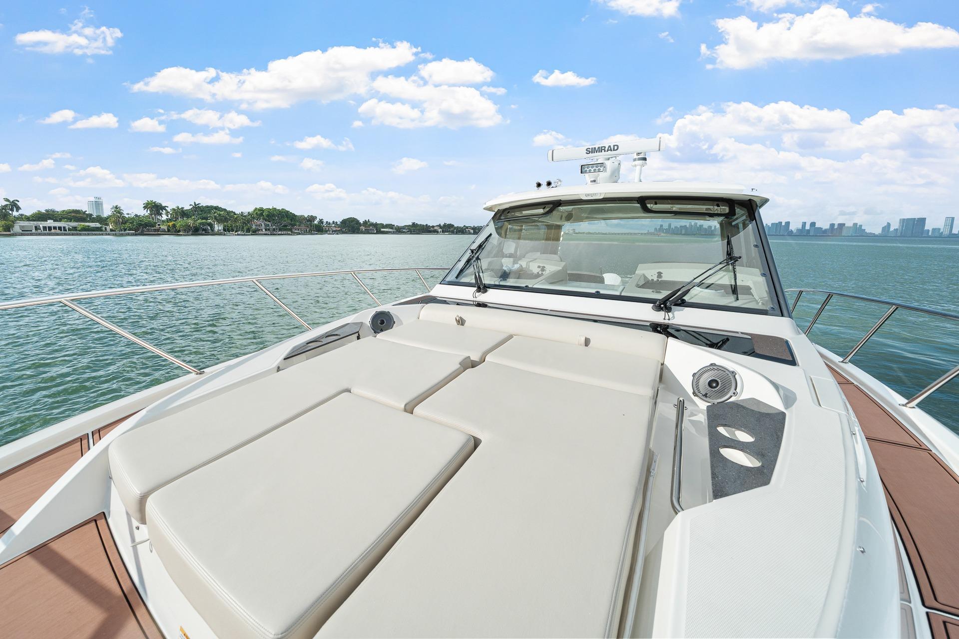 2024 Boston Whaler 405 Conquest yacht on calm waters under a clear sky.