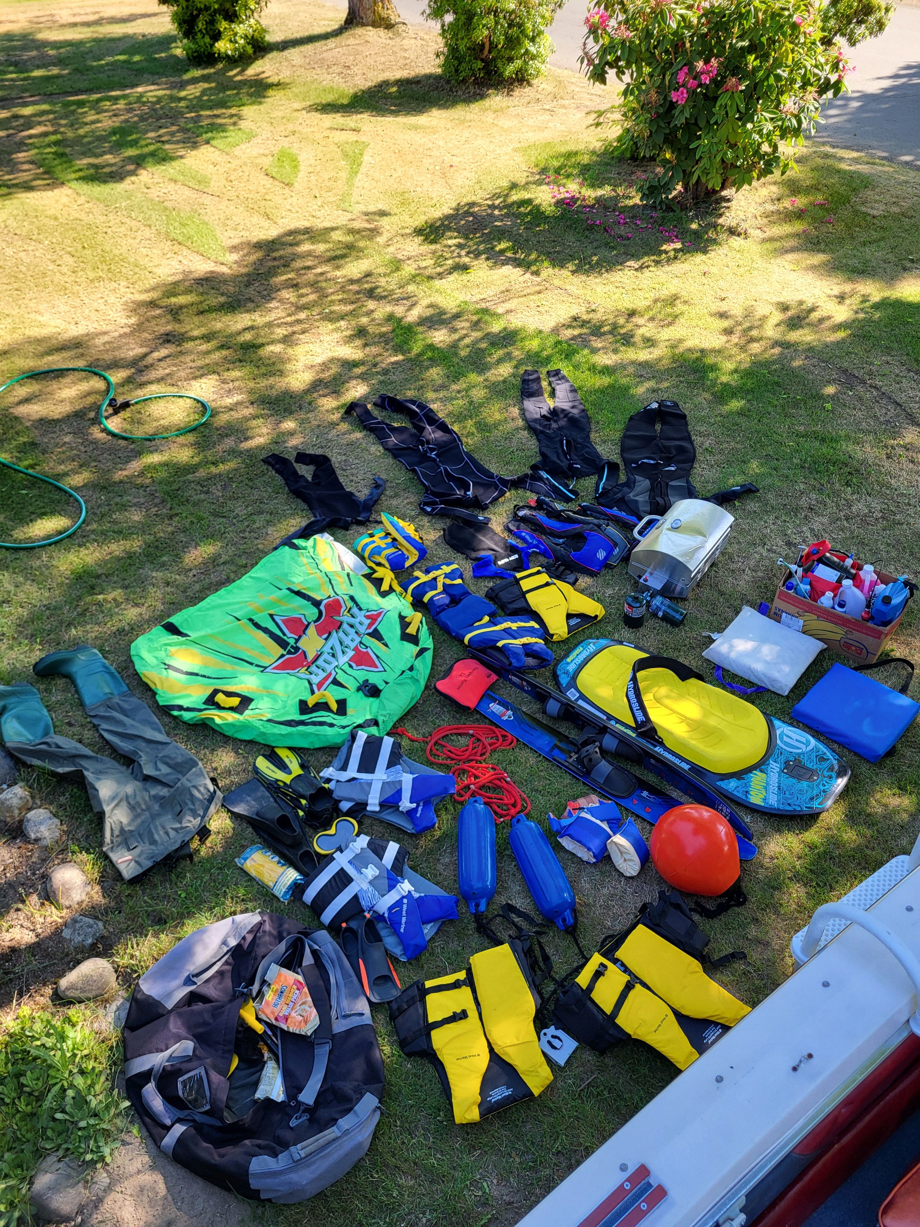 Boat gear spread on grass beside 1977 Bayliner Jamaica.