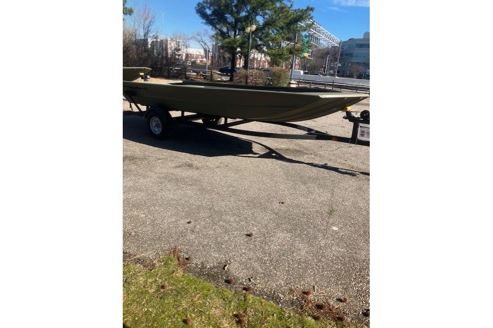 2026 Tracker Grizzly 1754 Utility boat on trailer in outdoor setting.