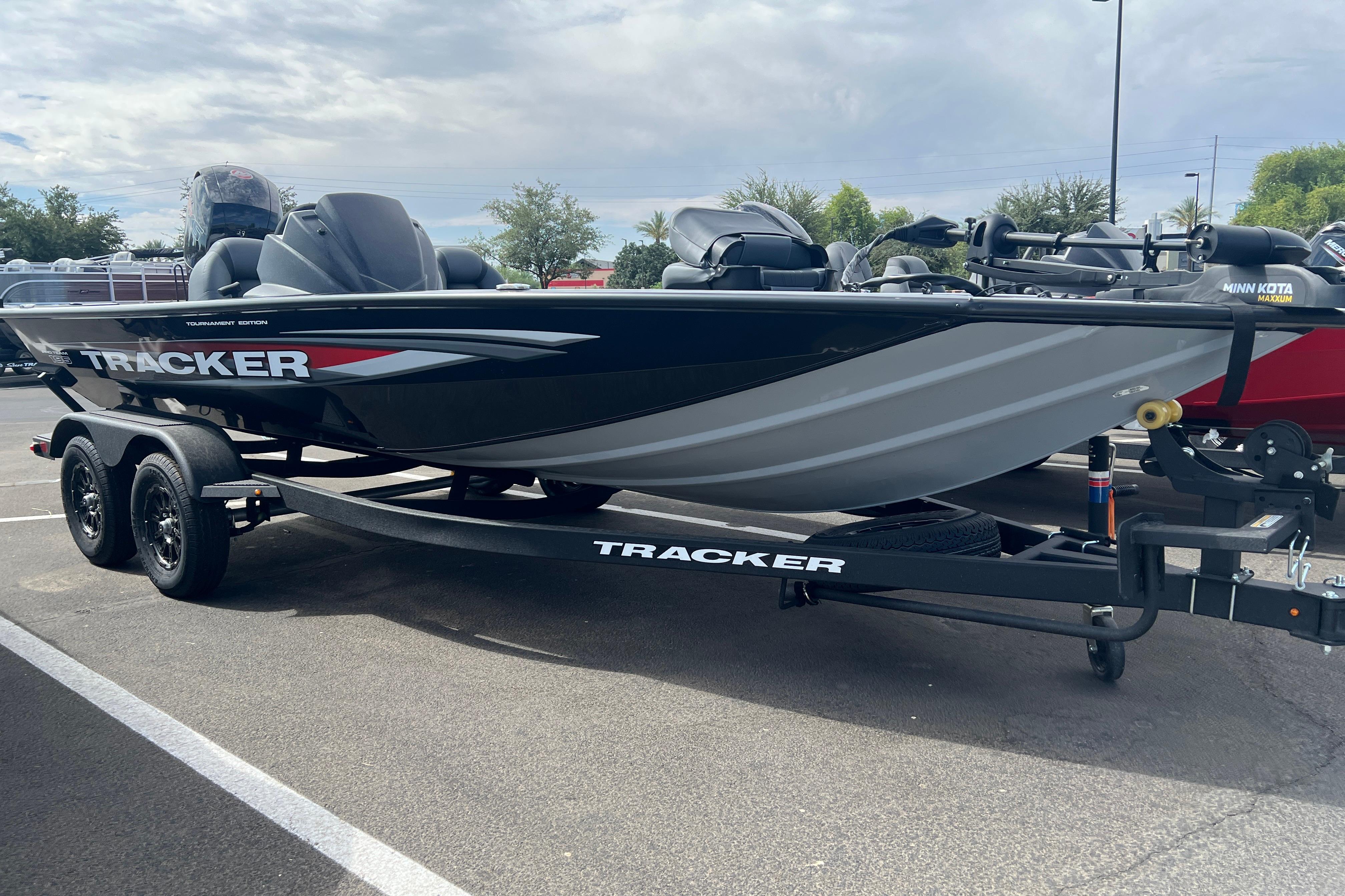 2026 Tracker Pro Team 195 boat on trailer, parked outdoors.