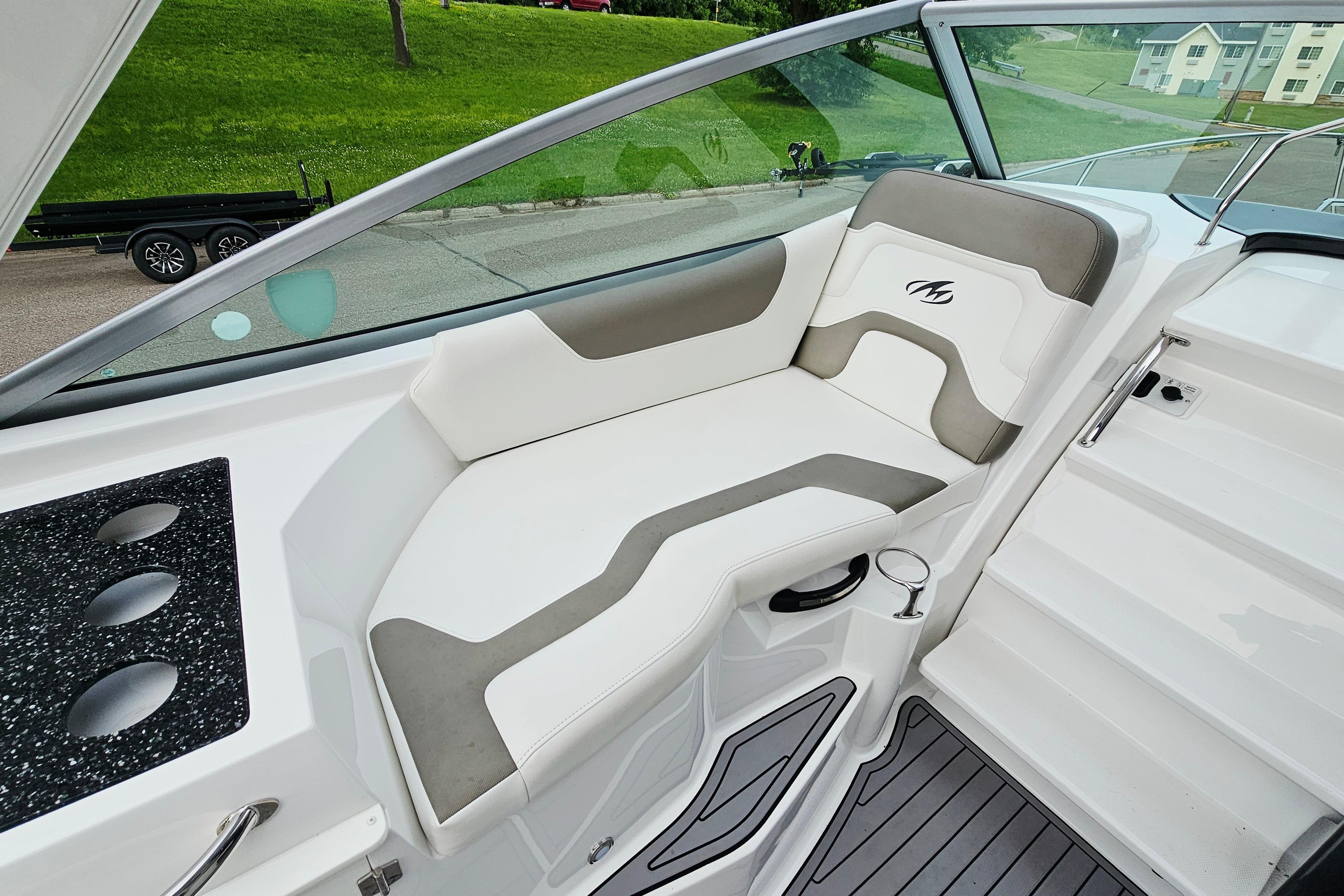 2016 Monterey 295 Sport Yacht interior with white and gray seating, sleek design.