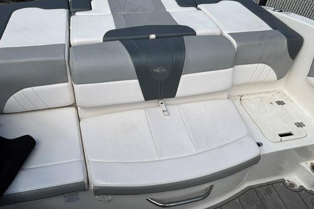 2021 Chaparral 21 SSi boat seating area with gray and white upholstery.