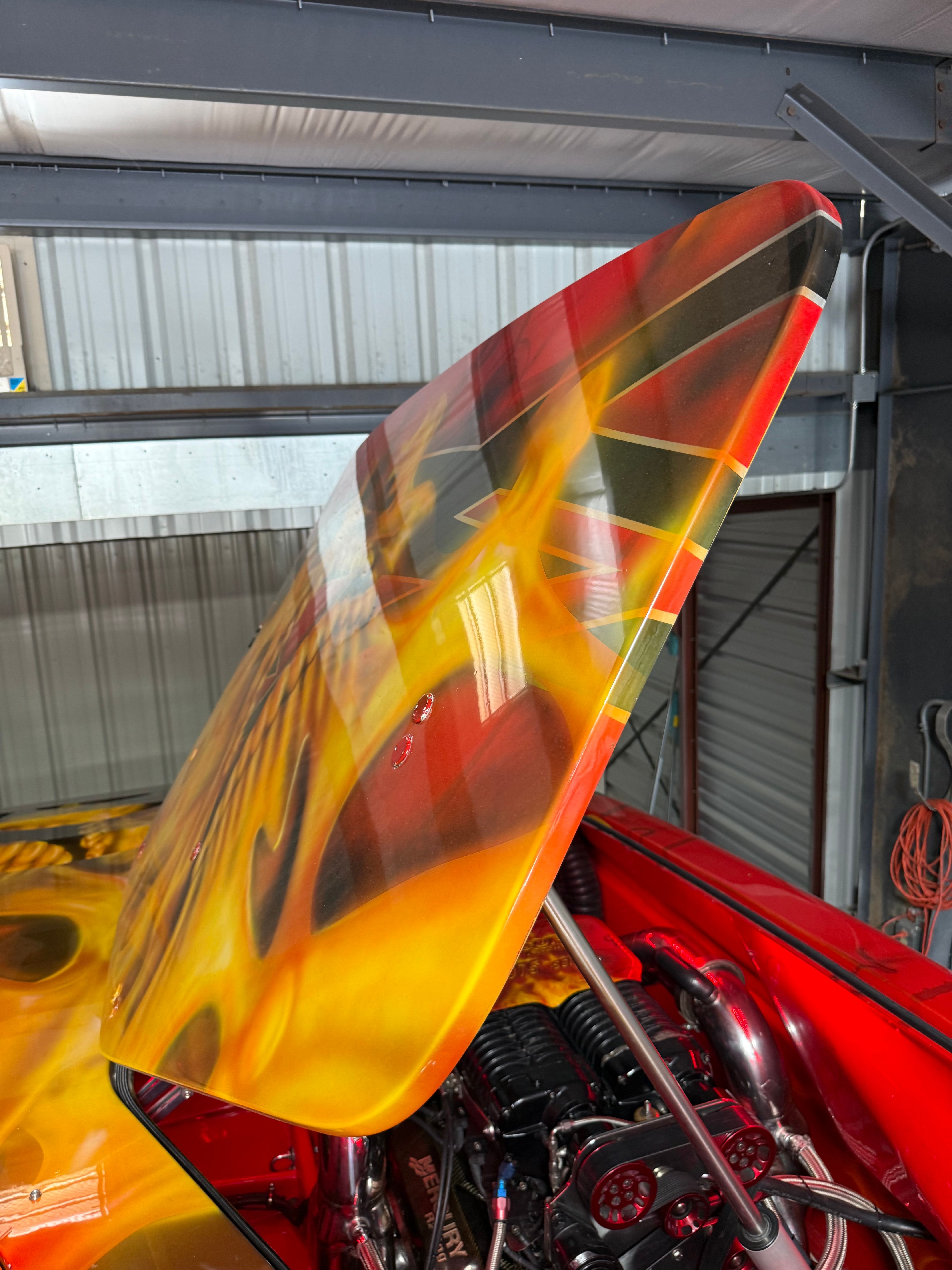 A 2010 MTI CAT with a striking flame design on the engine cover.