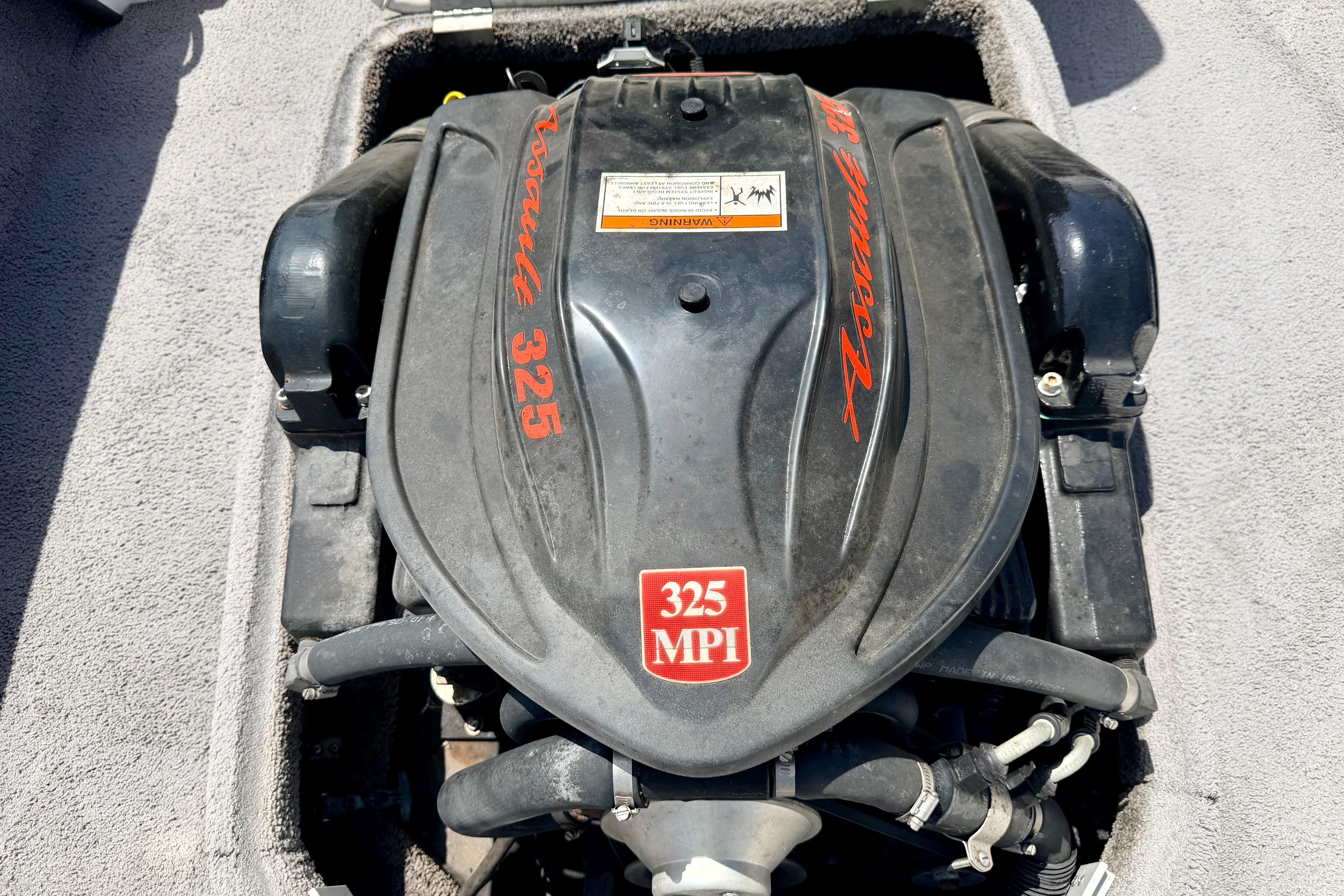 2008 Moomba Outback V engine, 325 MPI, black cover with red lettering.