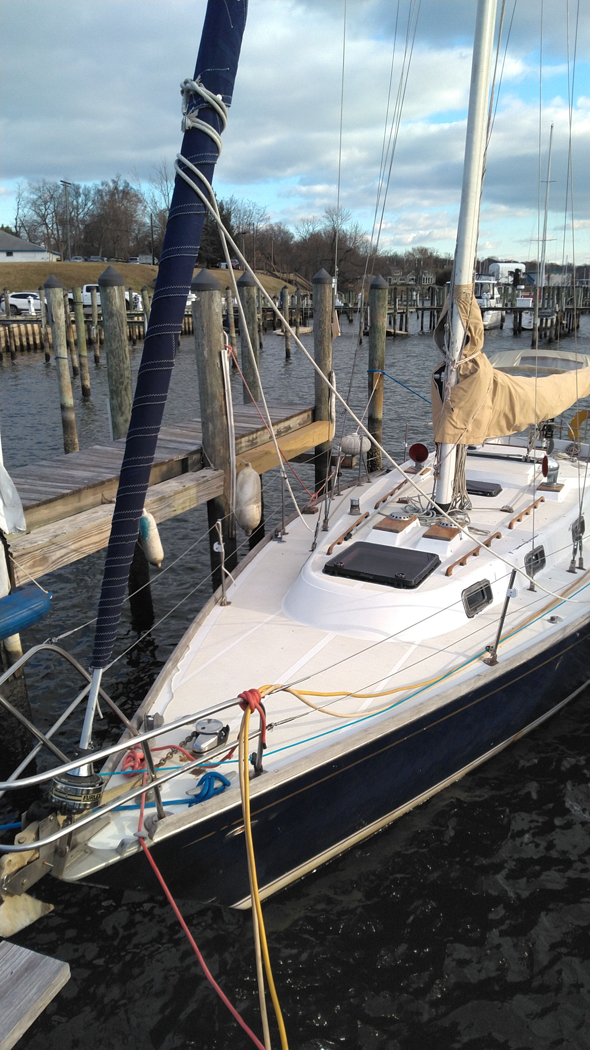 1978 Tartan 37 sailboat docked at marina.