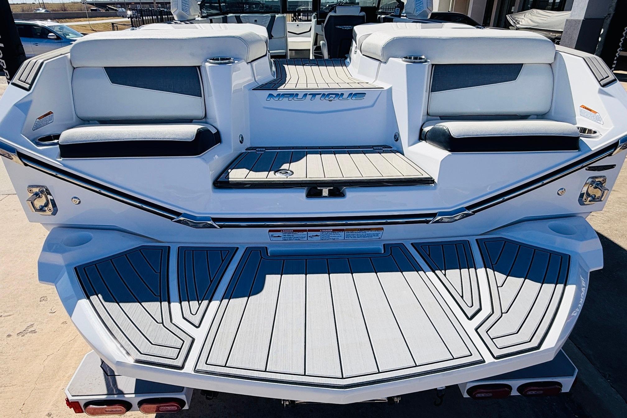 2023 Nautique Super Air Nautique G25 boat, rear view with seating and deck.