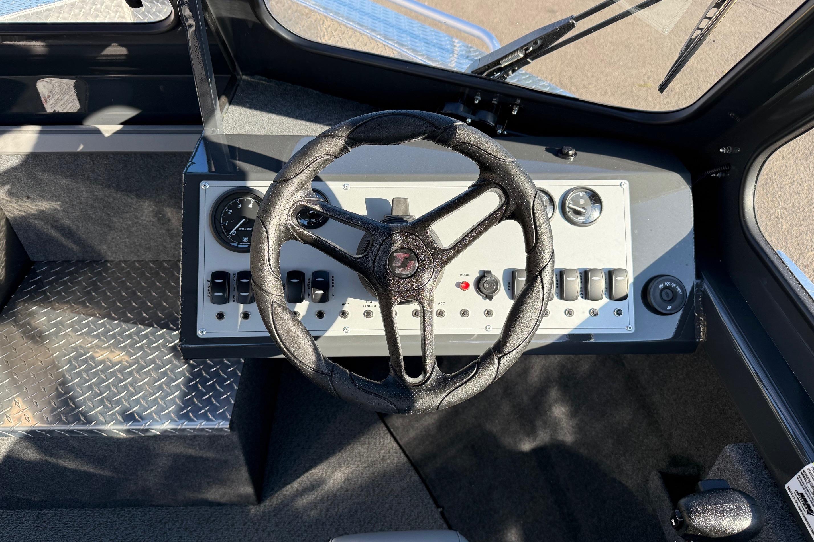 2026 Thunder Jet 200 Luxor boat dashboard with steering wheel and control panel.