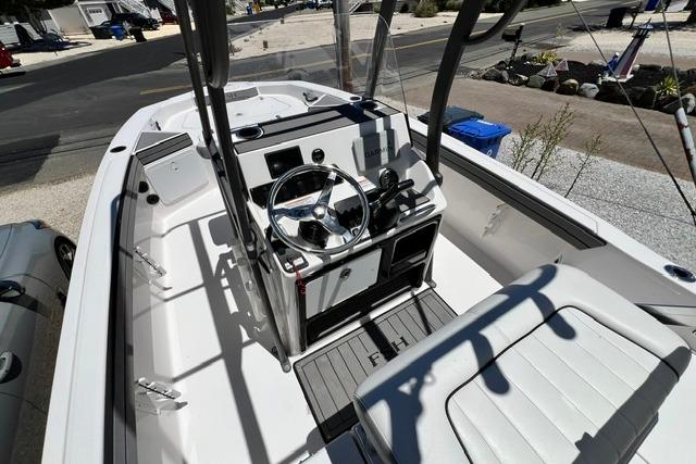 2019 Yamaha Boats 190 FSH Sport interior with steering wheel and seating.
