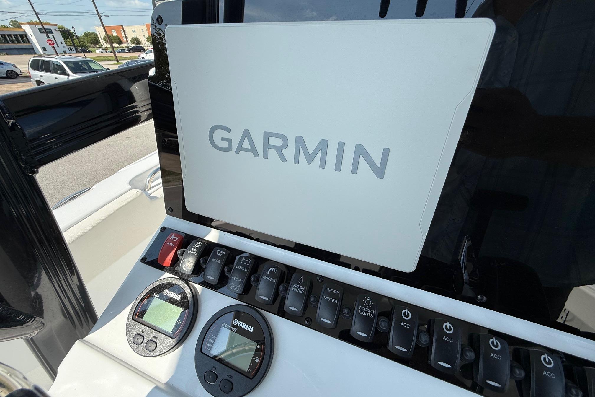 2026 Sea Hunt Ultra 229 boat dashboard with Garmin navigation system and Yamaha controls.