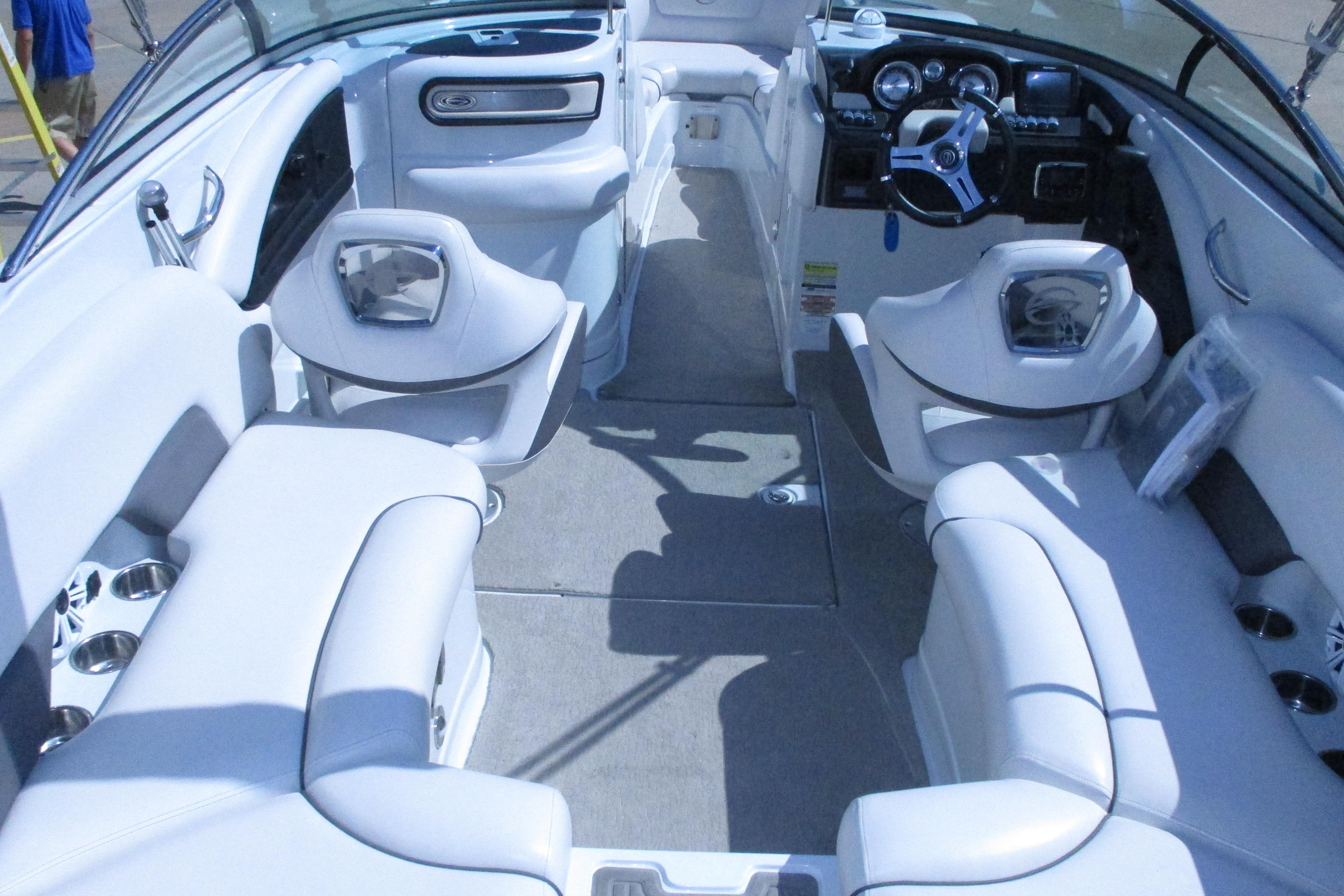 2017 Crownline 255 SS boat interior with white seating and modern dashboard.
