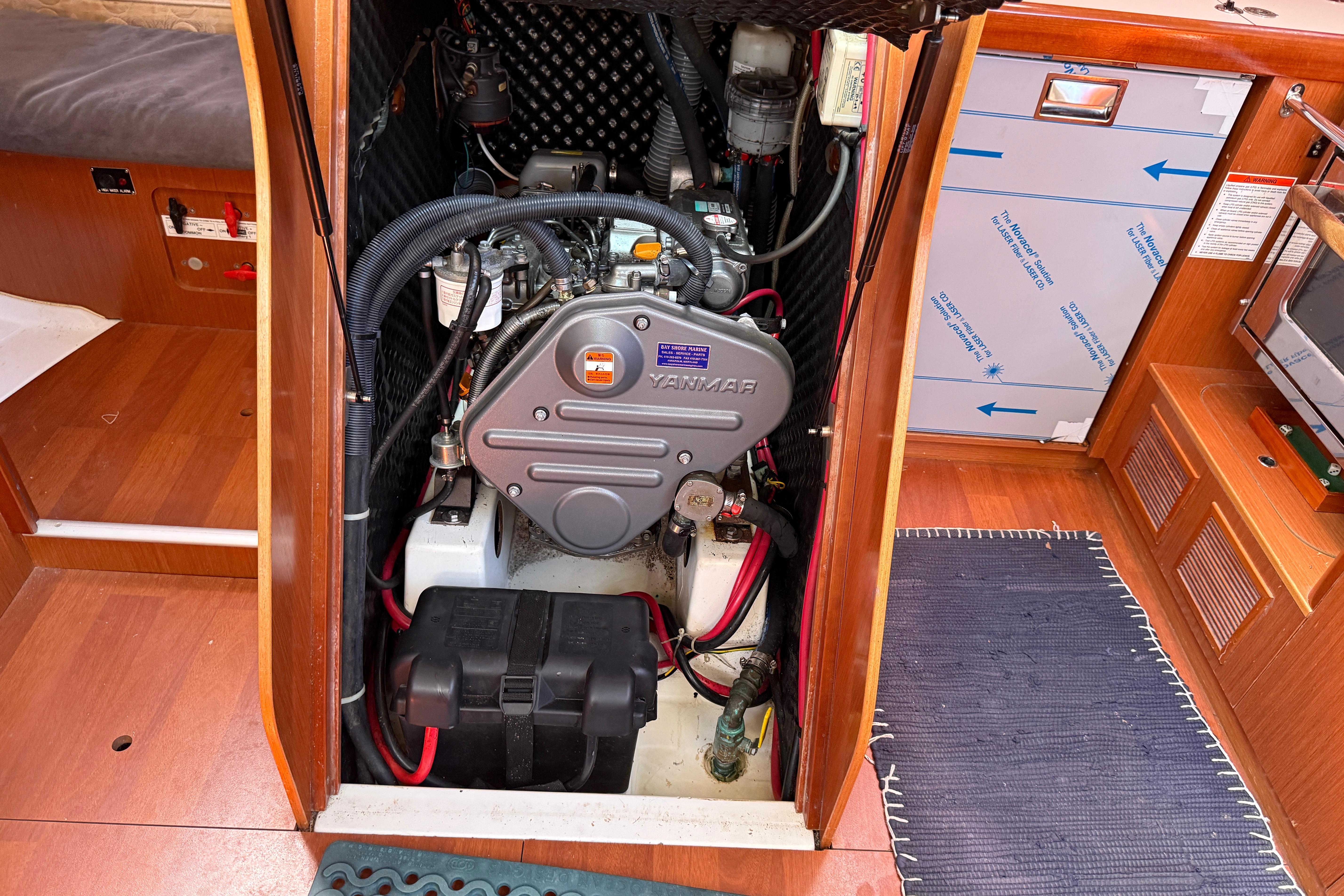Engine compartment of a 2010 Beneteau Oceanis 43 sailboat, featuring a Yanmar engine.