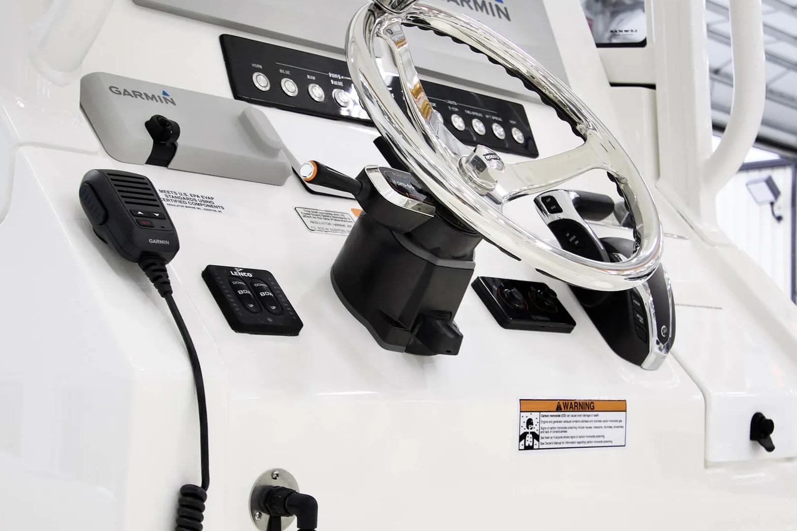 Steering console of 2027 Regulator 24XO boat with Garmin electronics and controls.